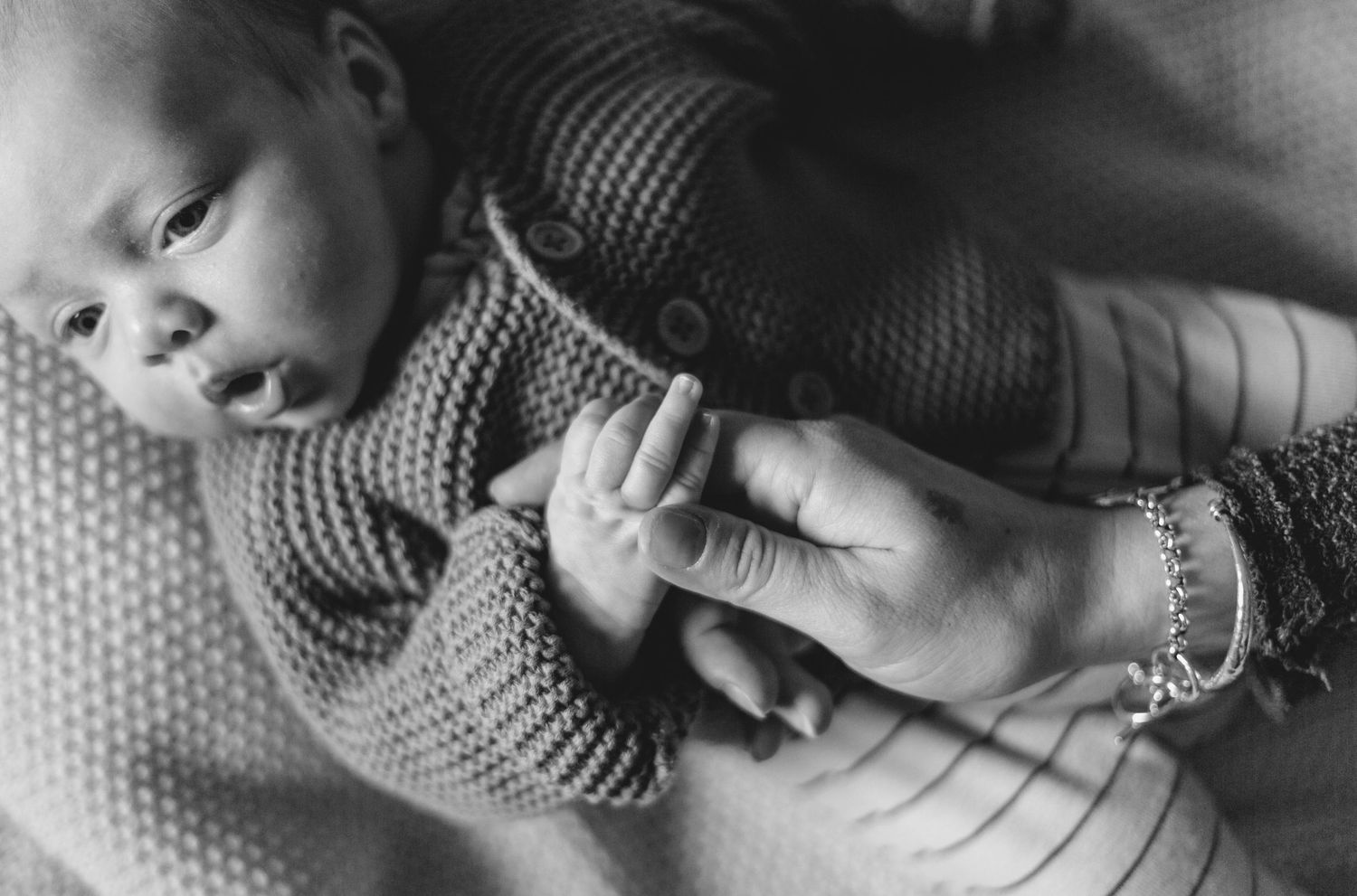 Newborn Photographer captures maternity photos of mother and baby. Newborn photography session captured by Morzine newborn Photographer