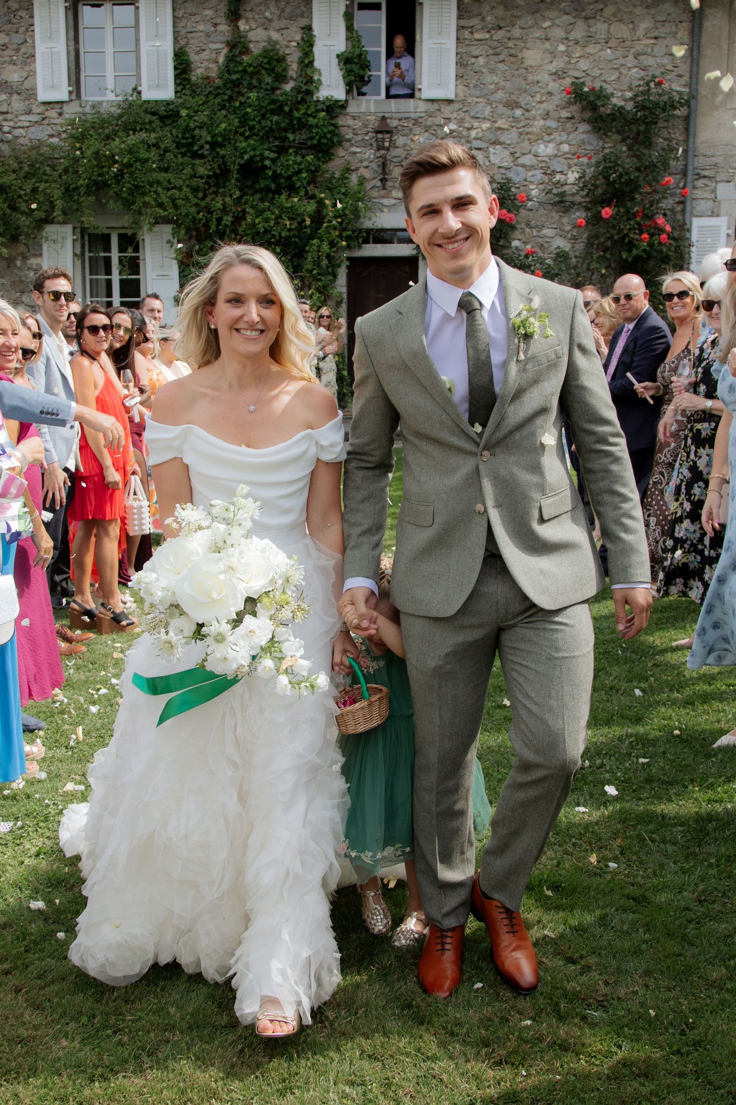 Documentary style Wedding Photographer captures confetti photos at Morzine Wedding venue. Natural, timeless and candid wedding photography.