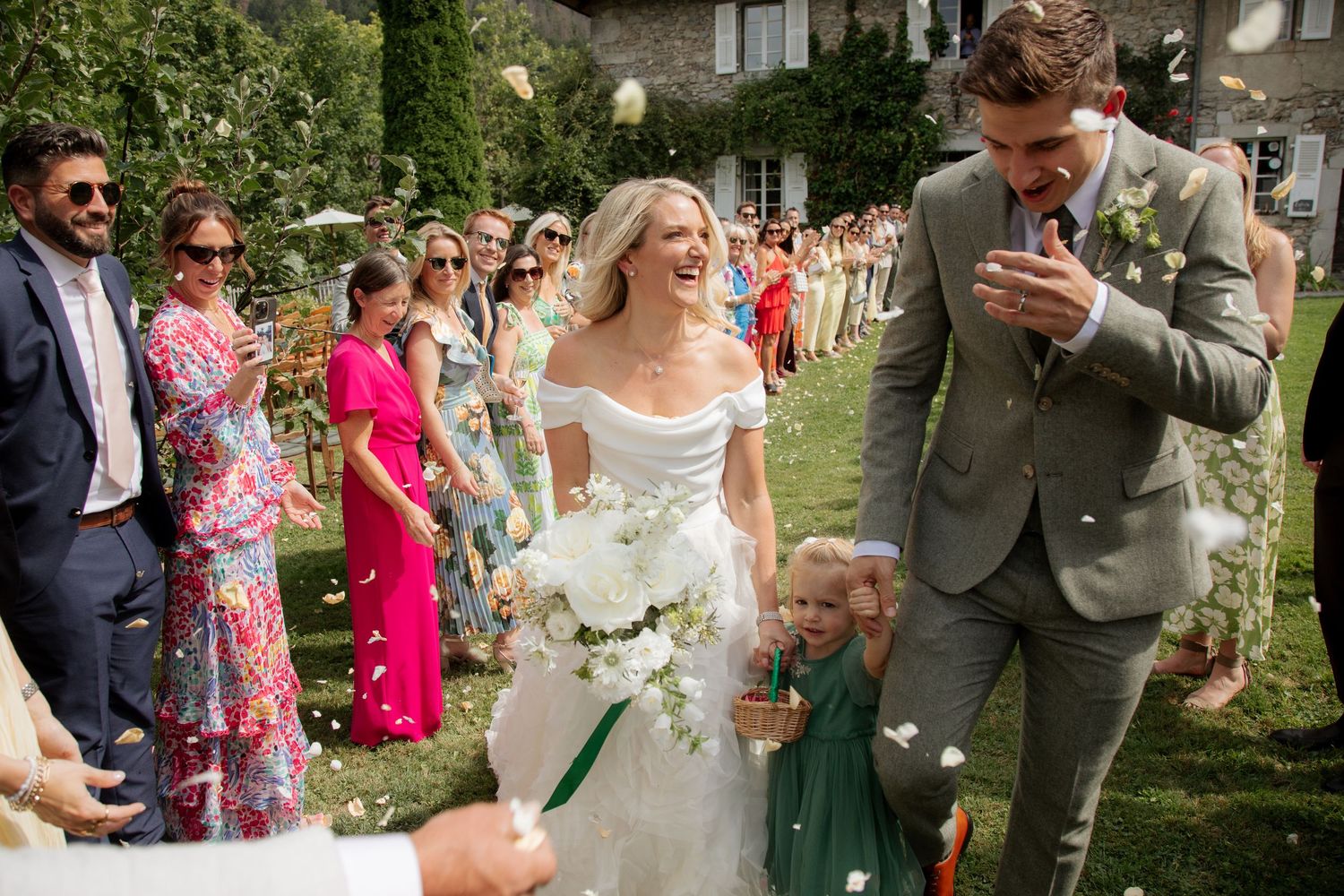 Documentary style Wedding Photographer captures confetti photos at Morzine Wedding venue. Natural, timeless and candid wedding photography.