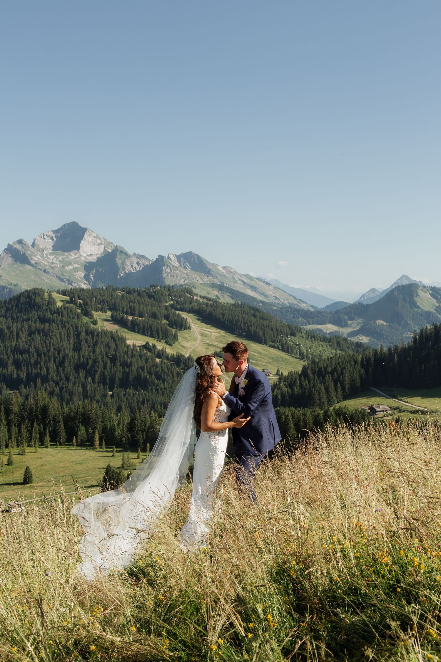 Morzine Wedding Photographer captures bride and groom photos in La Clusaz Wedding venue. French Mountain Wedding photographer. Outdoor Bride
