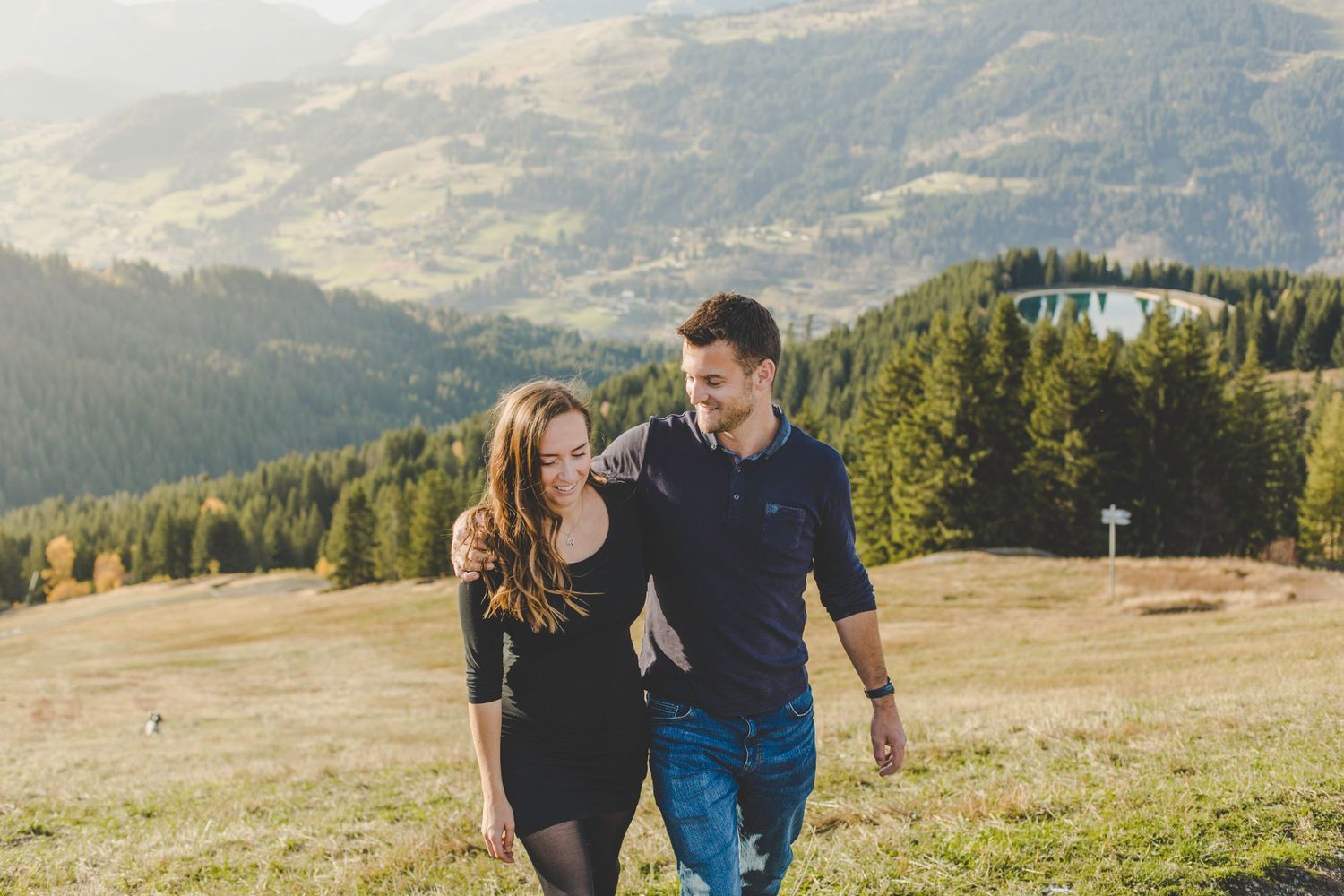 Mountain top proposal. engagement photo at golden hour captured by natural and candid wedding photographer in a Les Gets wedding venue