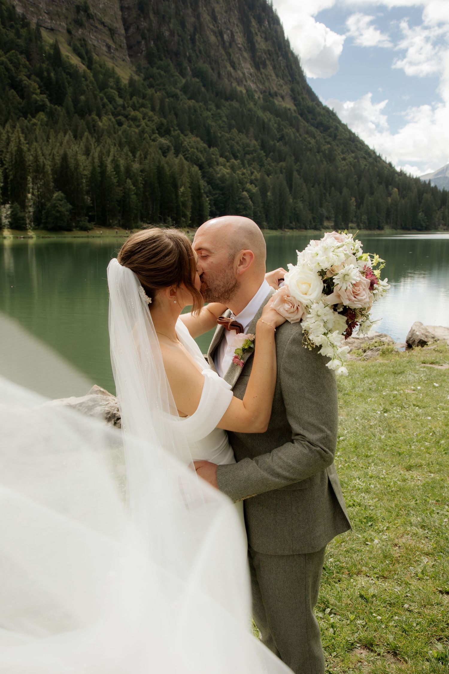 Morzine Wedding photographer captures intimate wedding cermeony photos on Lac Montriond. Candid timeless documentary style photography.