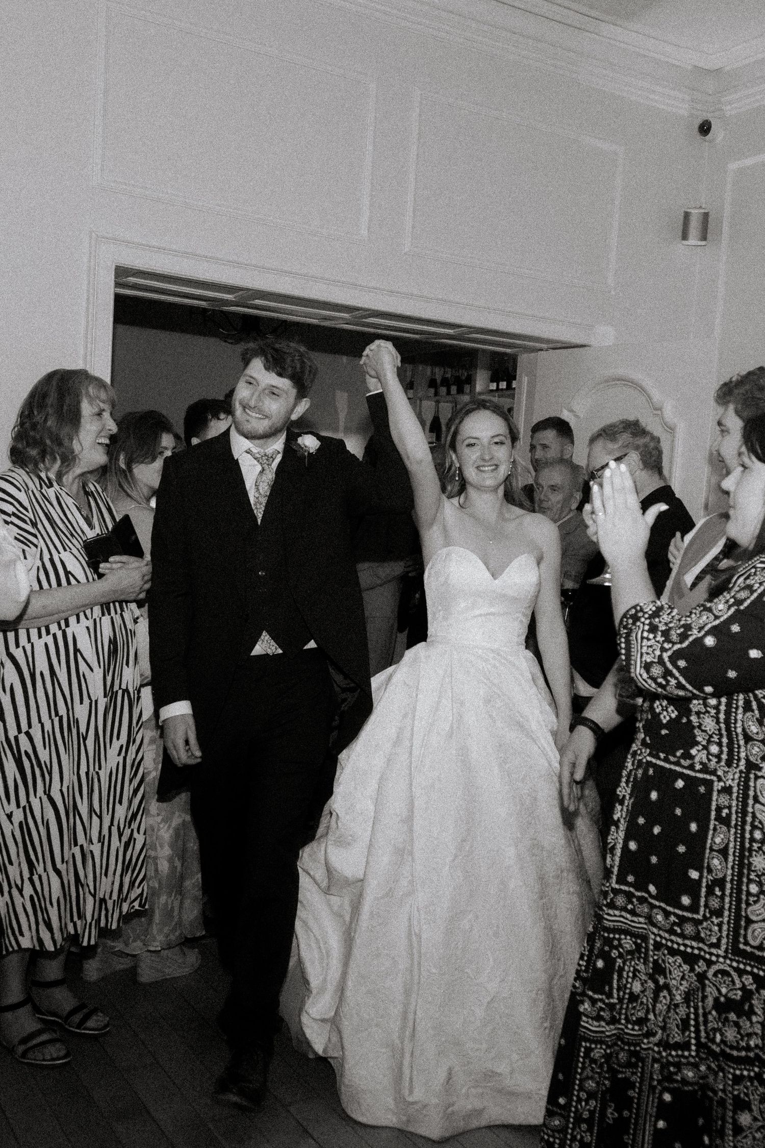 Documentary Style Cotswold Wedding Photographer captures wedding party at a Gloucestershire Wedding Venue. natural and candid wedding photos