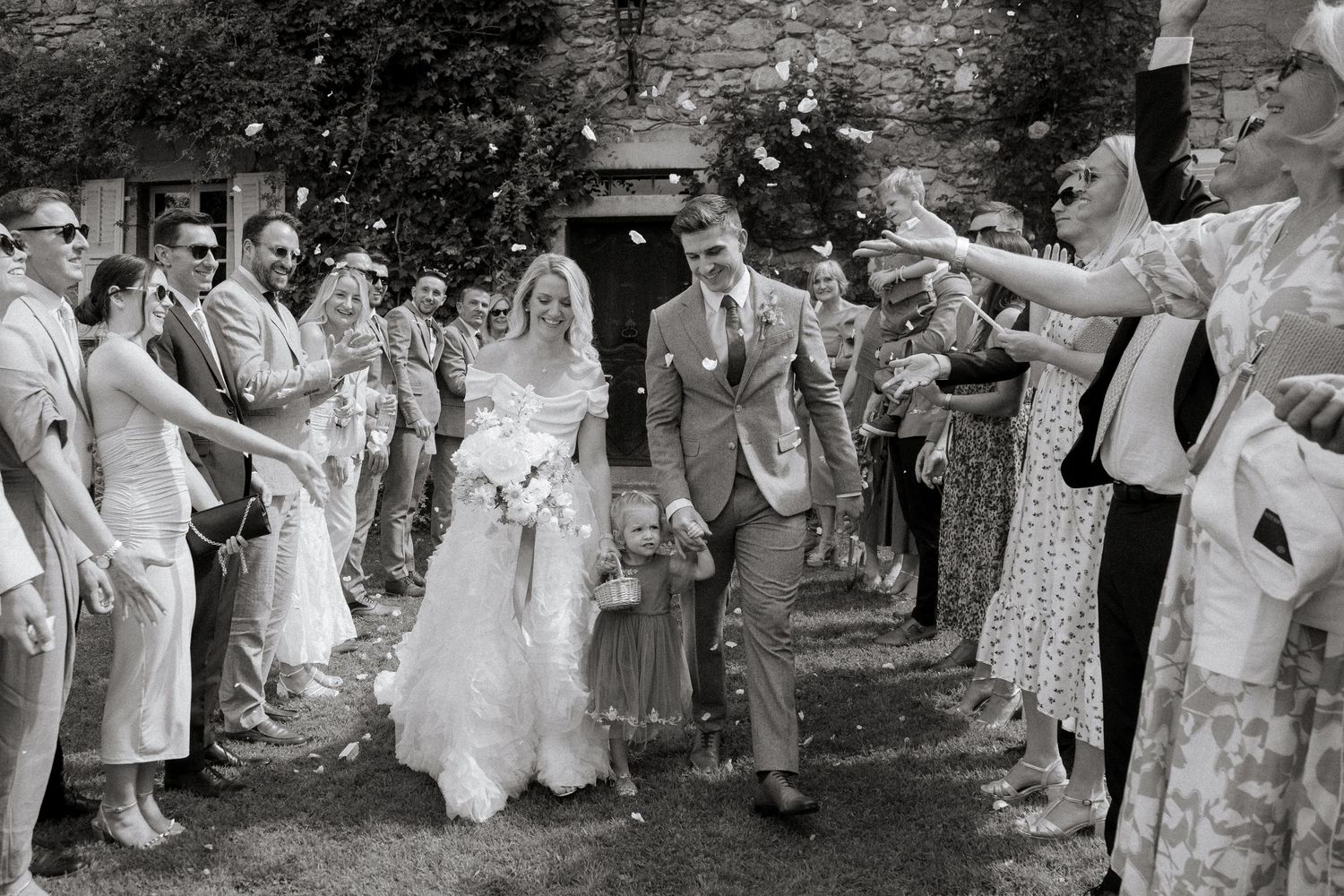 Documentary style Wedding Photographer captures confetti photos at Morzine Wedding venue. Natural, timeless and candid wedding photography.
