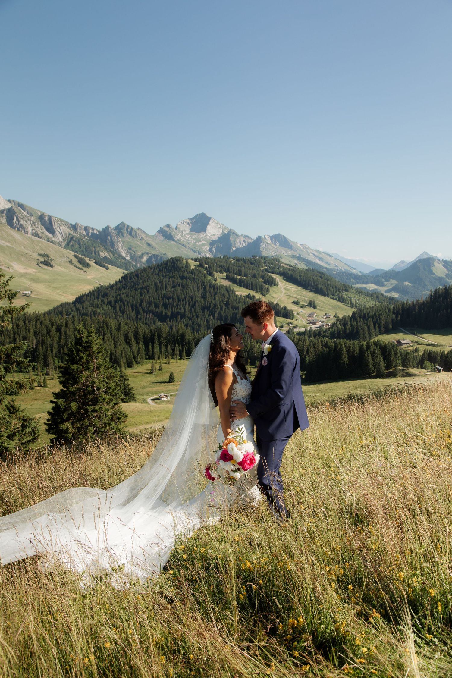 Morzine Wedding Photographer captures bride and groom photos in La Clusaz Wedding venue. French Mountain Wedding photographer. Outdoor Bride