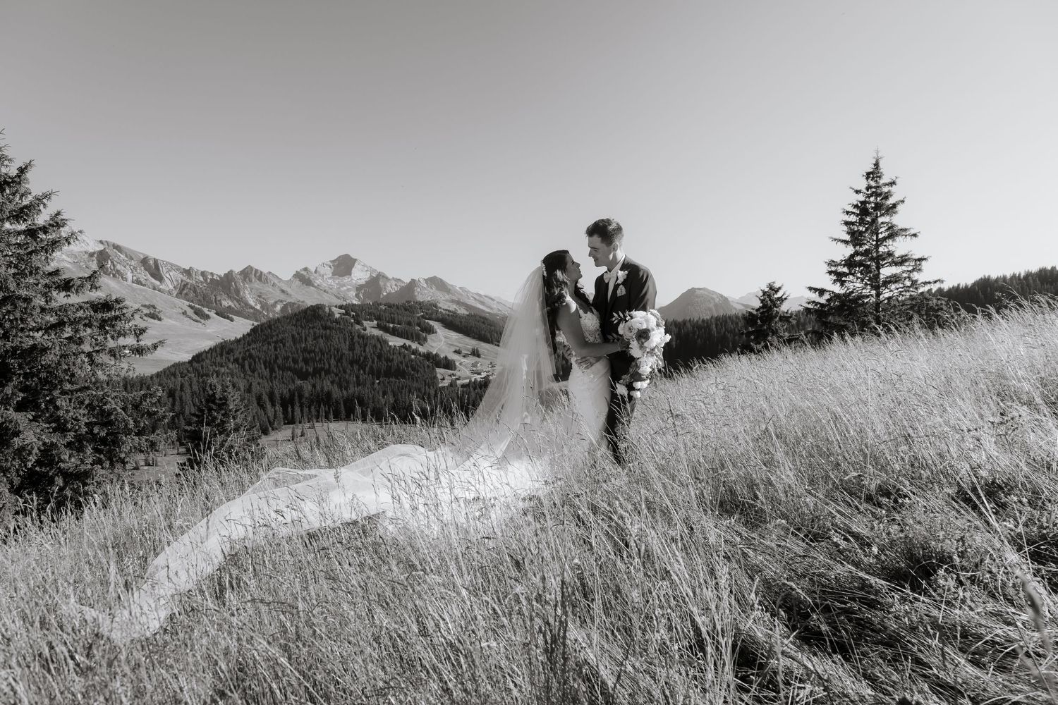 Morzine Wedding Photographer captures bride and groom photos in La Clusaz Wedding venue. French Mountain Wedding photographer. Outdoor Bride