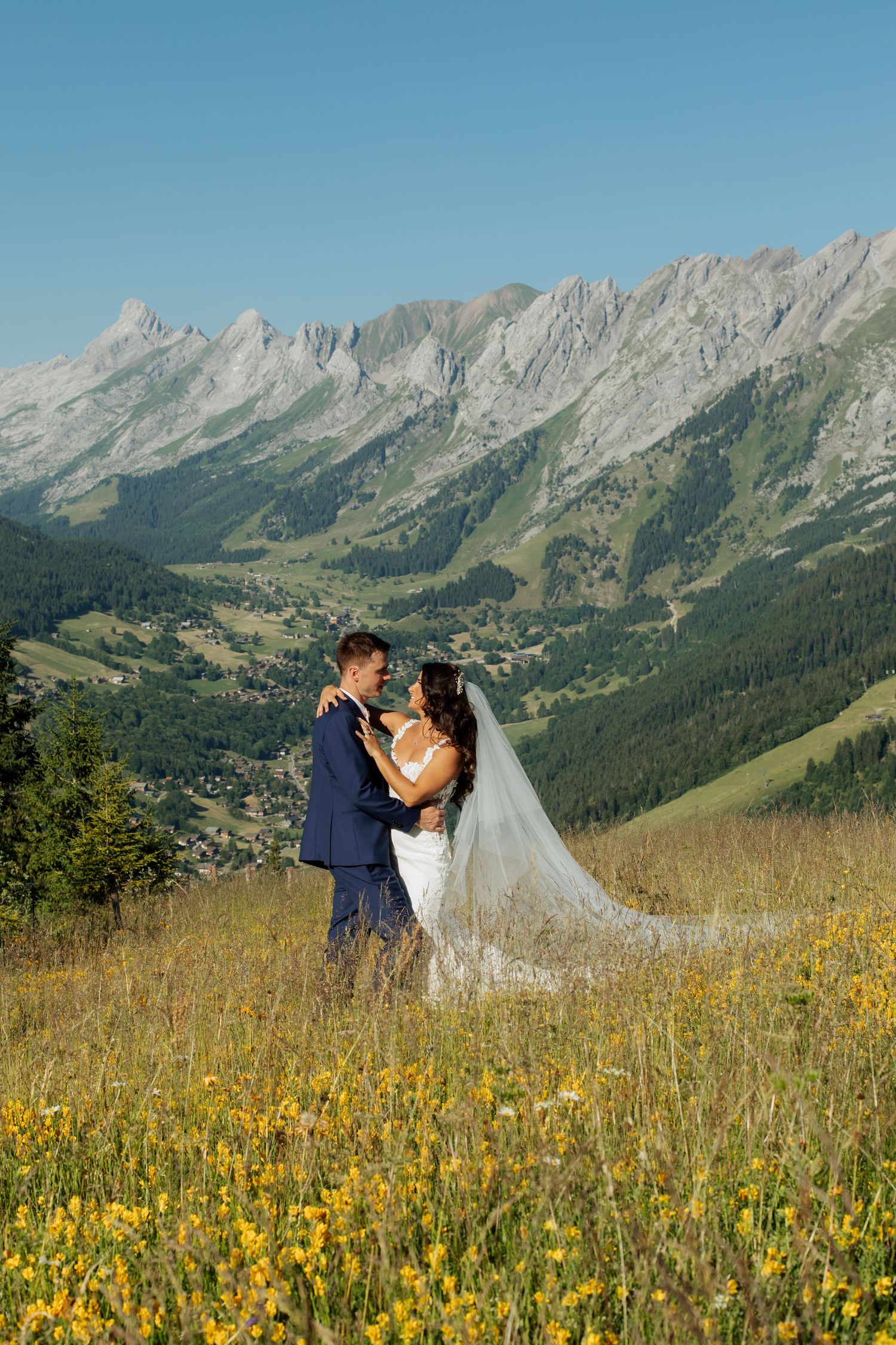Morzine Wedding Photographer captures bride and groom photos in La Clusaz Wedding venue. French Mountain Wedding photographer. Outdoor Bride
