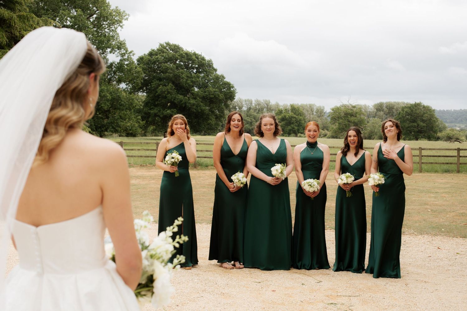Candid Cotswold Wedding Photographer captures bridal party at Gloucestershire Wedding Venue. Natural, candid and timeless photography, UKCan