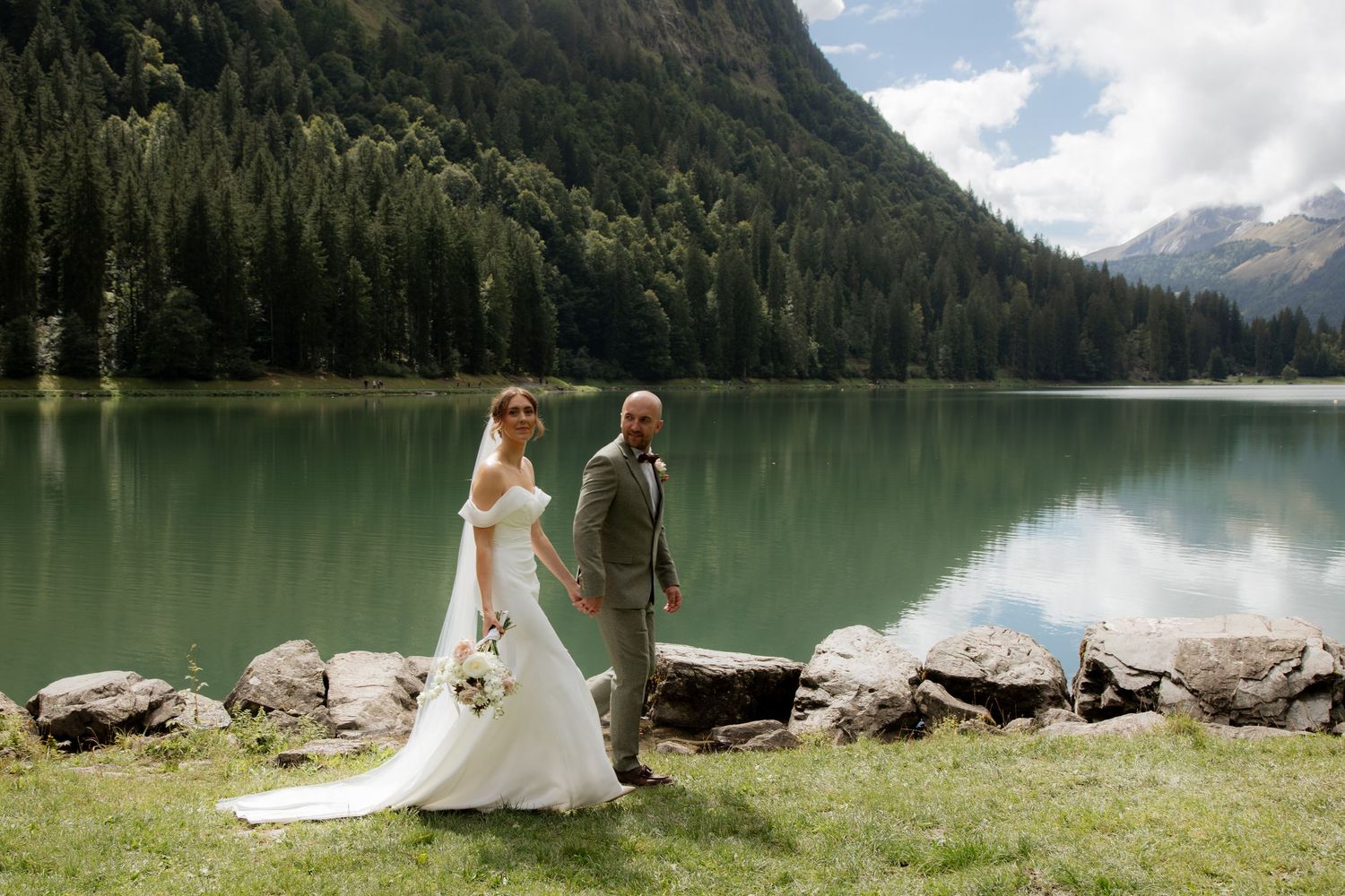 Morzine Wedding photographer captures epic outdoor wedding ceremony photos on Lac Montriond.Candid timeless documentary style photography.