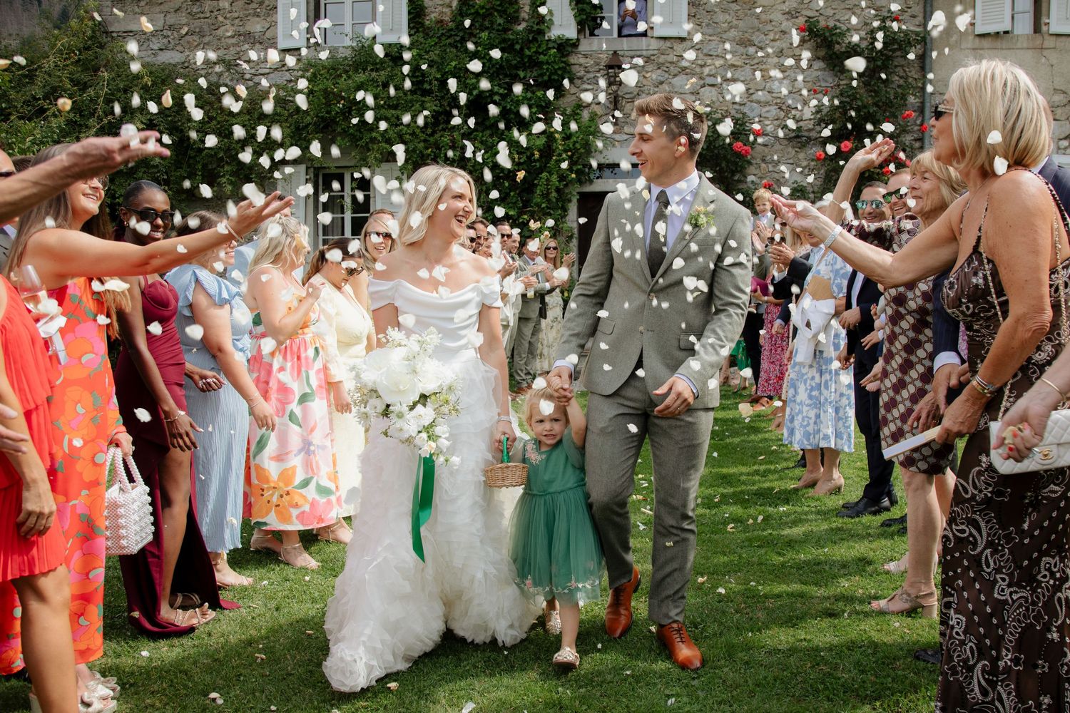 Documentary style Wedding Photographer captures confetti photos at Morzine Wedding venue. Natural, timeless and candid wedding photography.