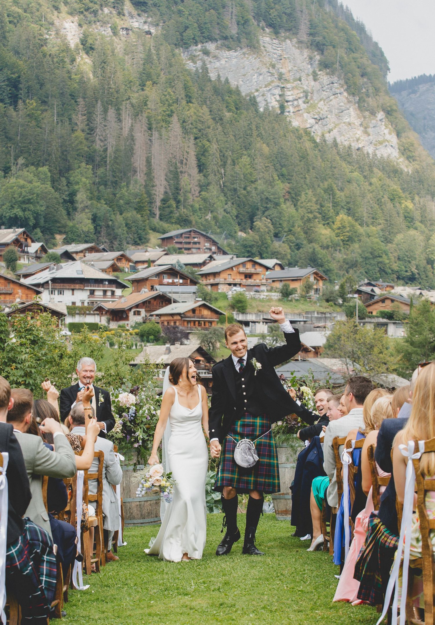 Bride and groom walking down the aisle in Morzine Wedding Venue, captured by morzine wedding photographer. VTL PHOTO