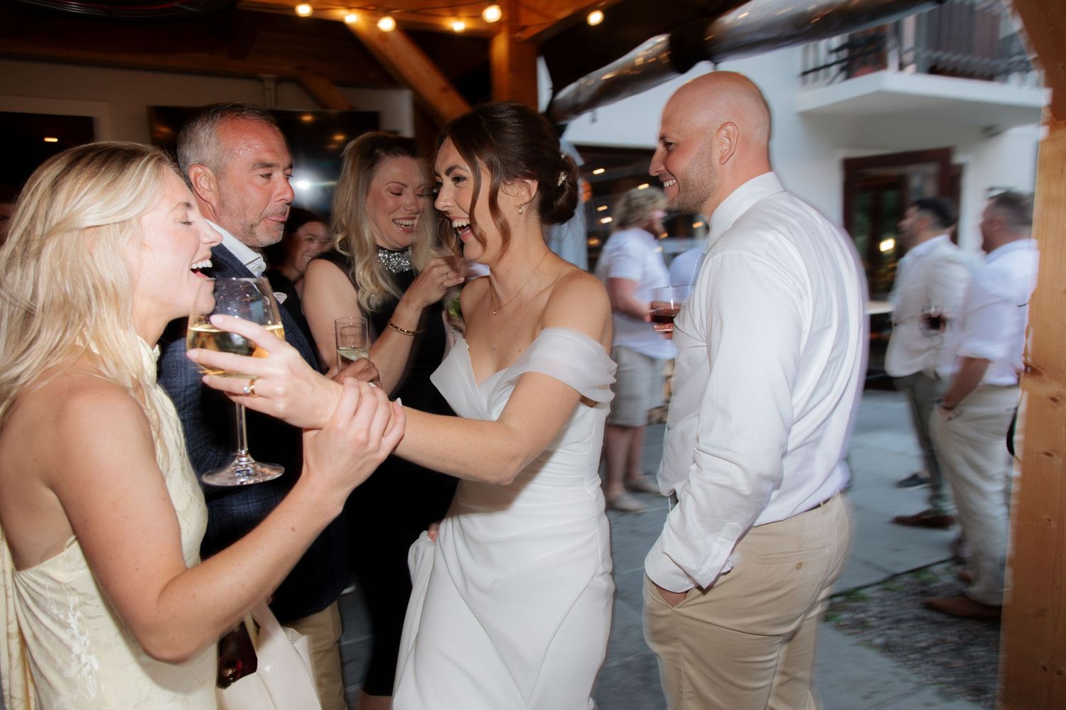 Morzine Wedding photographer captures flash photos of wedding party at Montriond Wedding Venue, Lake Montriond.Candid timeless documentary