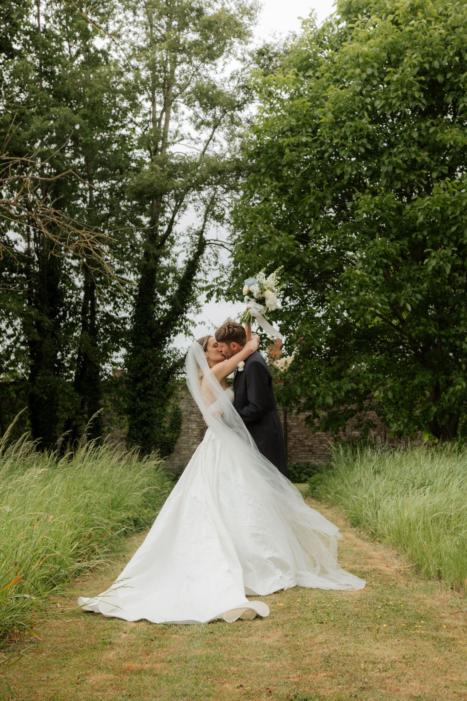 Cotswold Wedding Photographer captures candid ceremony photos at cotswold Wedding venue. Natural,honest & authentic storytelling.Cirencester
