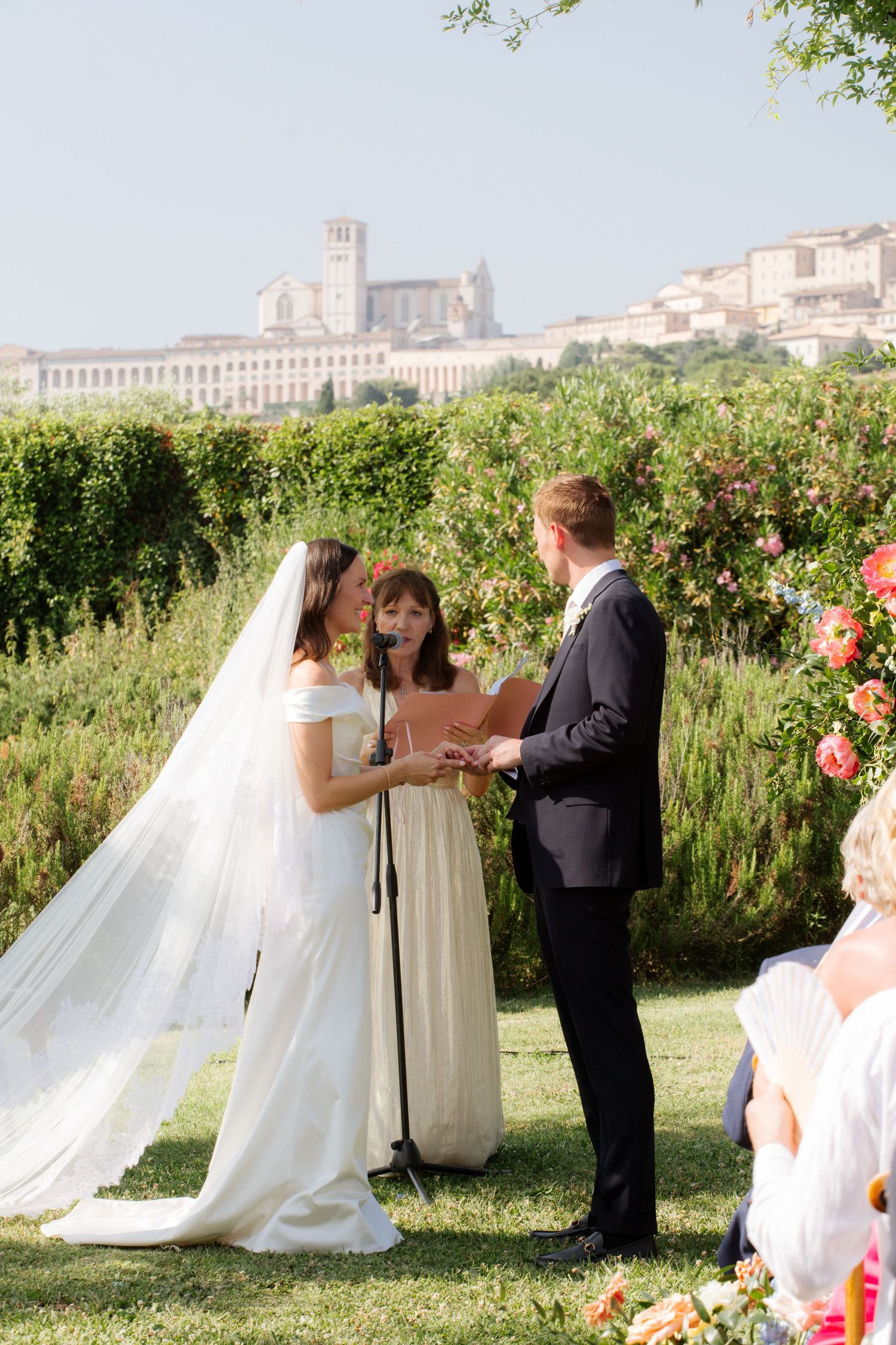 Assisi Wedding ceremony in Italy captured by destination wedding photographer, candid, natural style. Documentary style wedding photography.