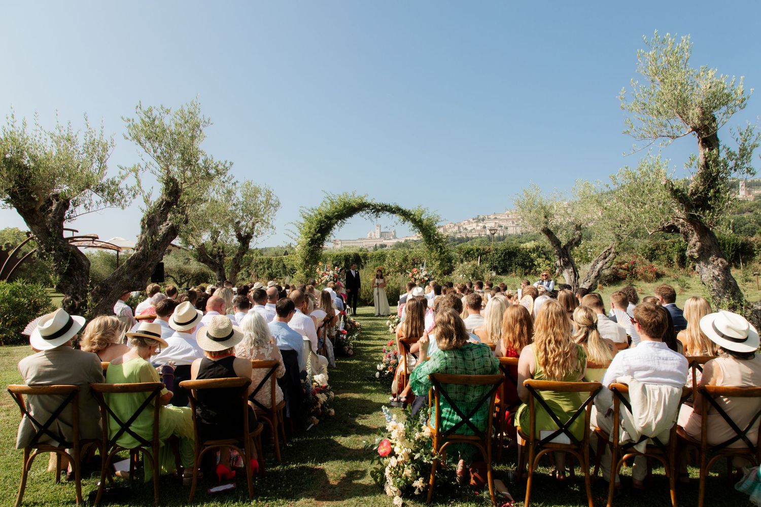 Assisi Wedding ceremony in Italy captured by destination wedding photographer, candid, natural style. Documentary style wedding photography.