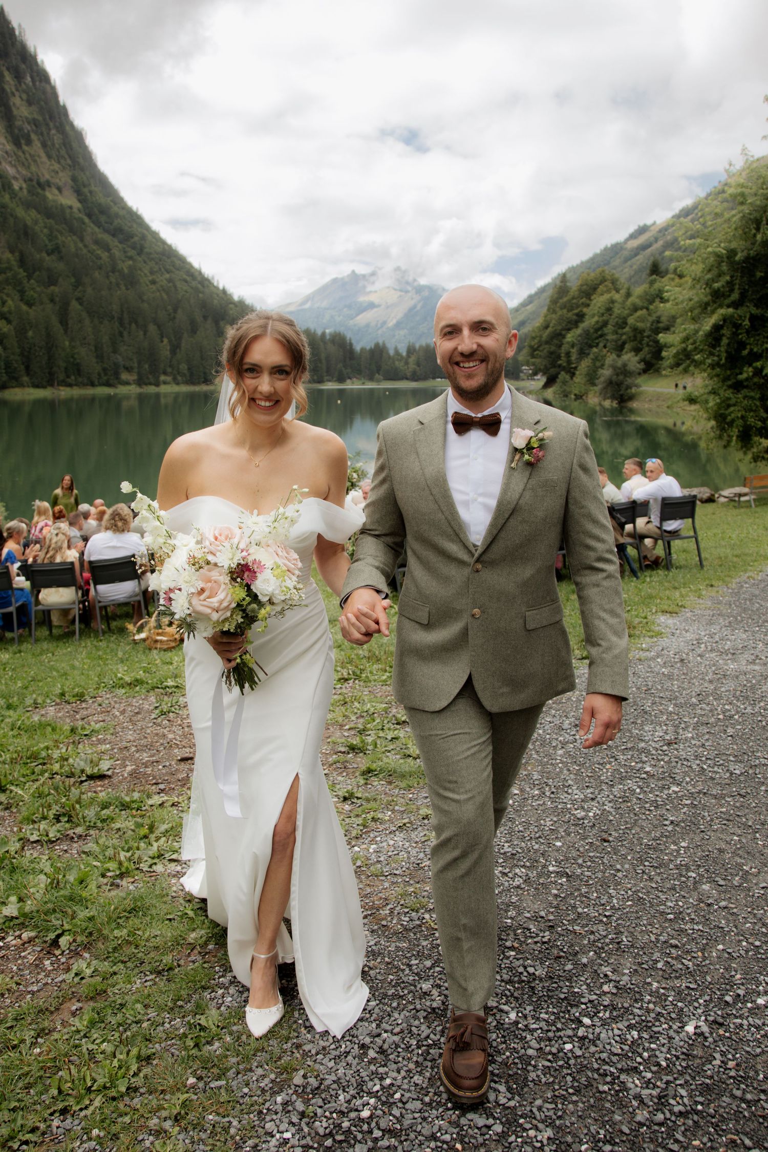 Morzine Wedding photographer captures outdoor wedding confetti photos on Lac Montriond. Candid timeless documentary style photography.