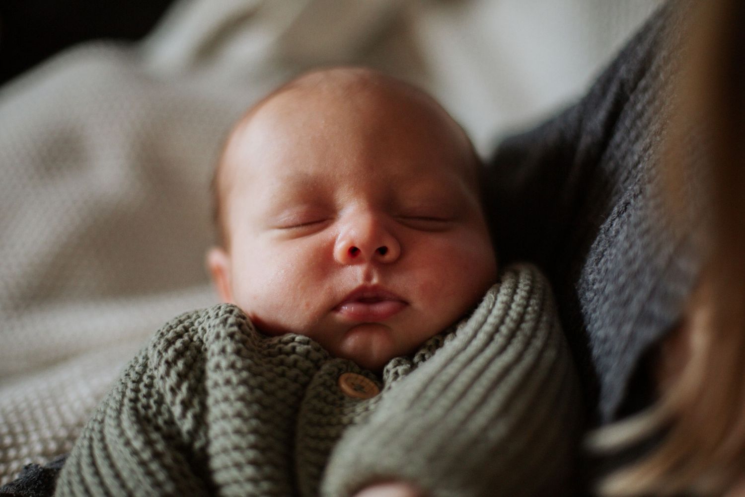 Newborn Photographer captures maternity photos of mother and baby. Newborn photography session captured by Morzine newborn Photographer