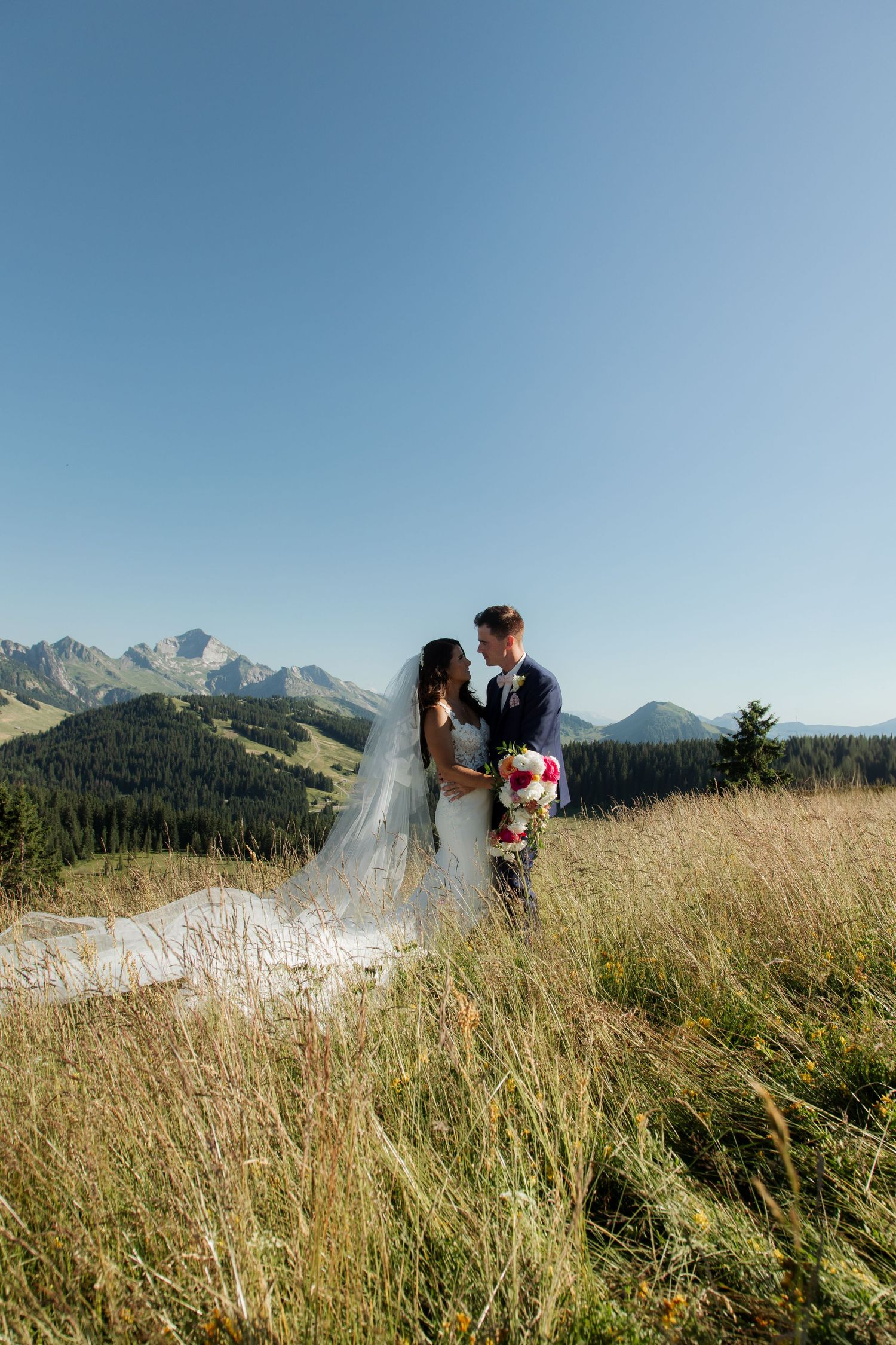 Morzine Wedding Photographer captures bride and groom photos in La Clusaz Wedding venue. French Mountain Wedding photographer. Outdoor Bride