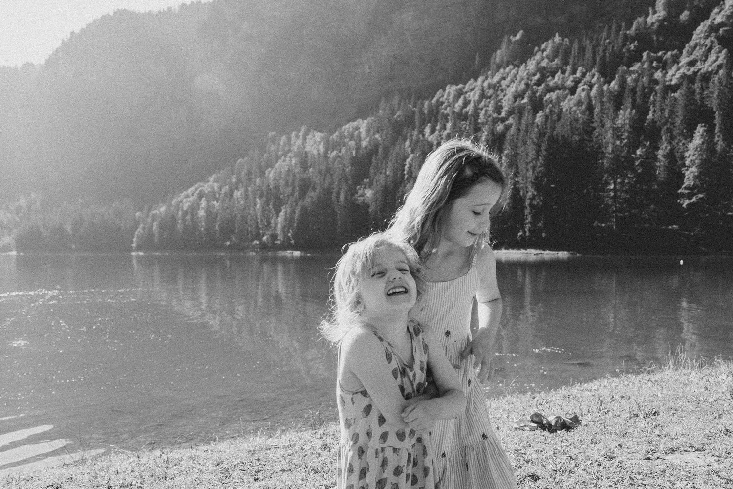 Family Photographer captures outdoor family photos. Family photography session captured by Morzine family Photographer at Lac Montriond
