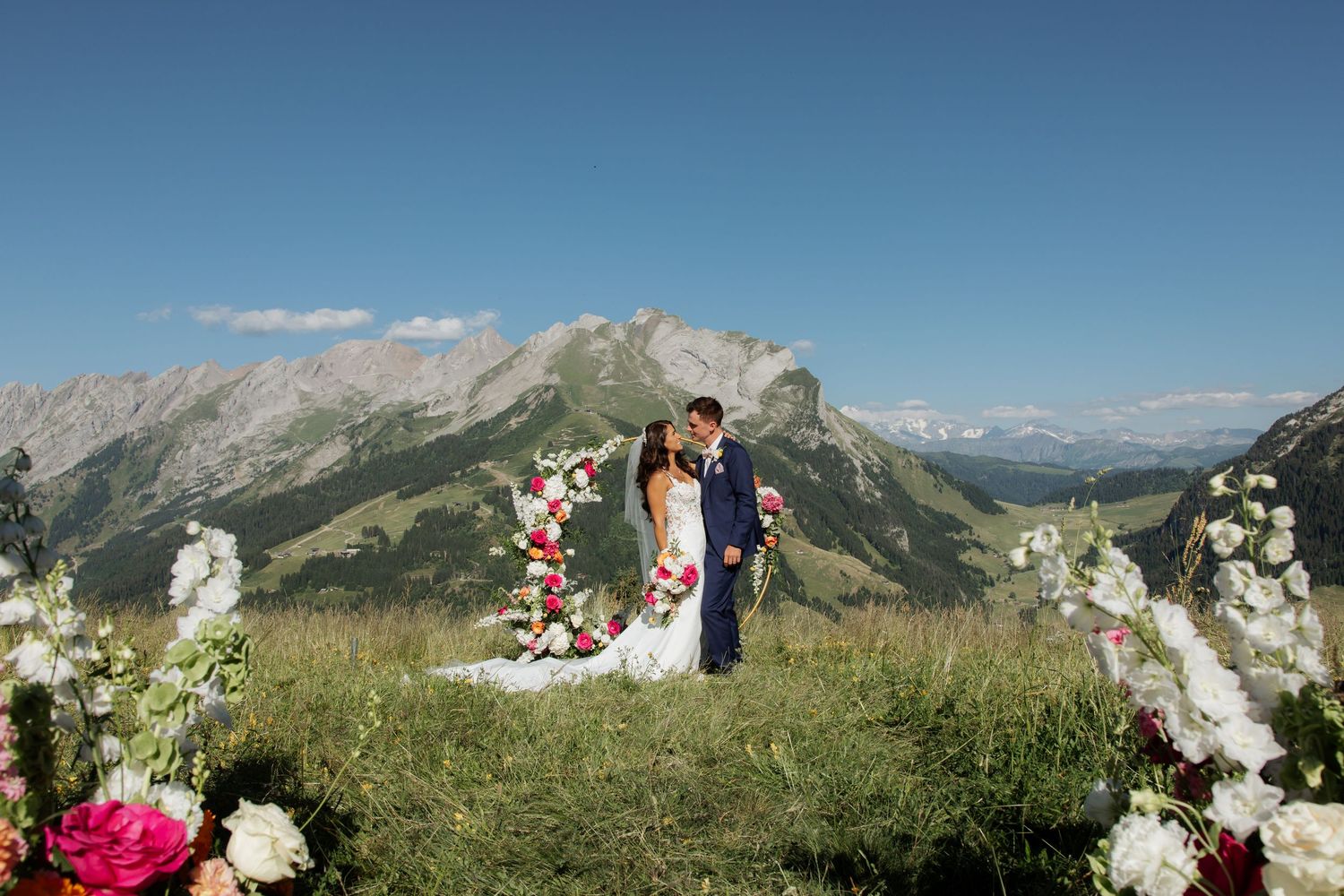 Morzine Wedding Photographer captures wedding ceremony photo at La Clusaz Wedding venue. French Mountain Wedding photographer. Outdoor Bride