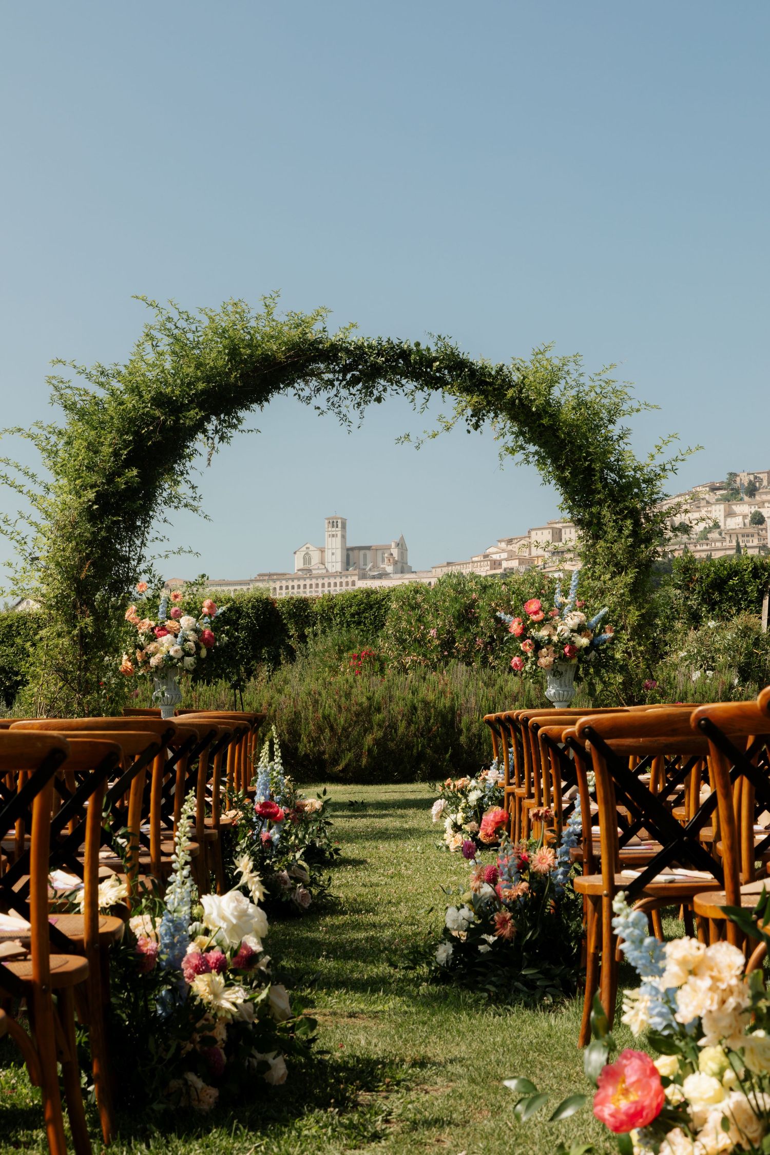 Assisi Wedding ceremony in Italy captured by destination wedding photographer, candid, natural style. Documentary style wedding photography.