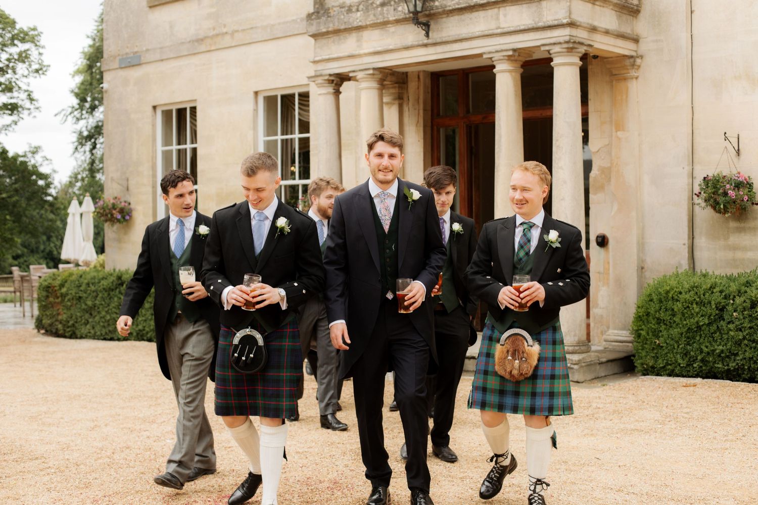 Documentary Style Cotswold Wedding Photographer captures groomsmen at Gloucestershire Wedding Venue.Natural,candid and timeless photography