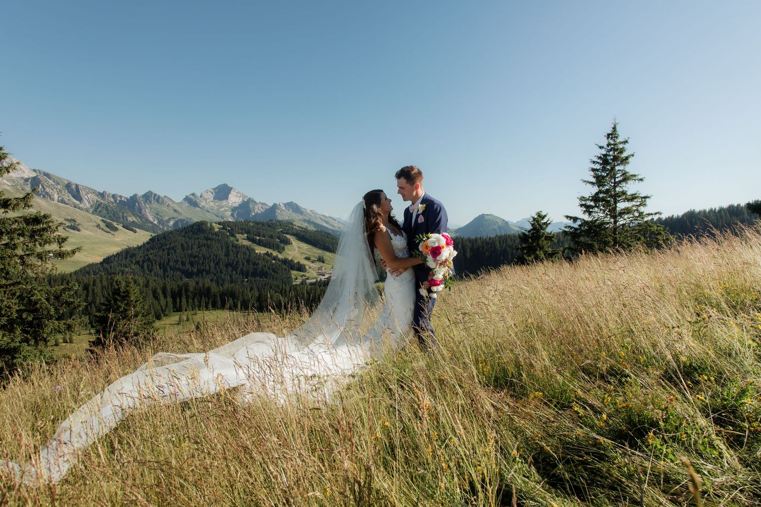 Morzine Wedding Photographer captures bride and groom photos in La Clusaz Wedding venue. French Mountain Wedding photographer. Outdoor Bride