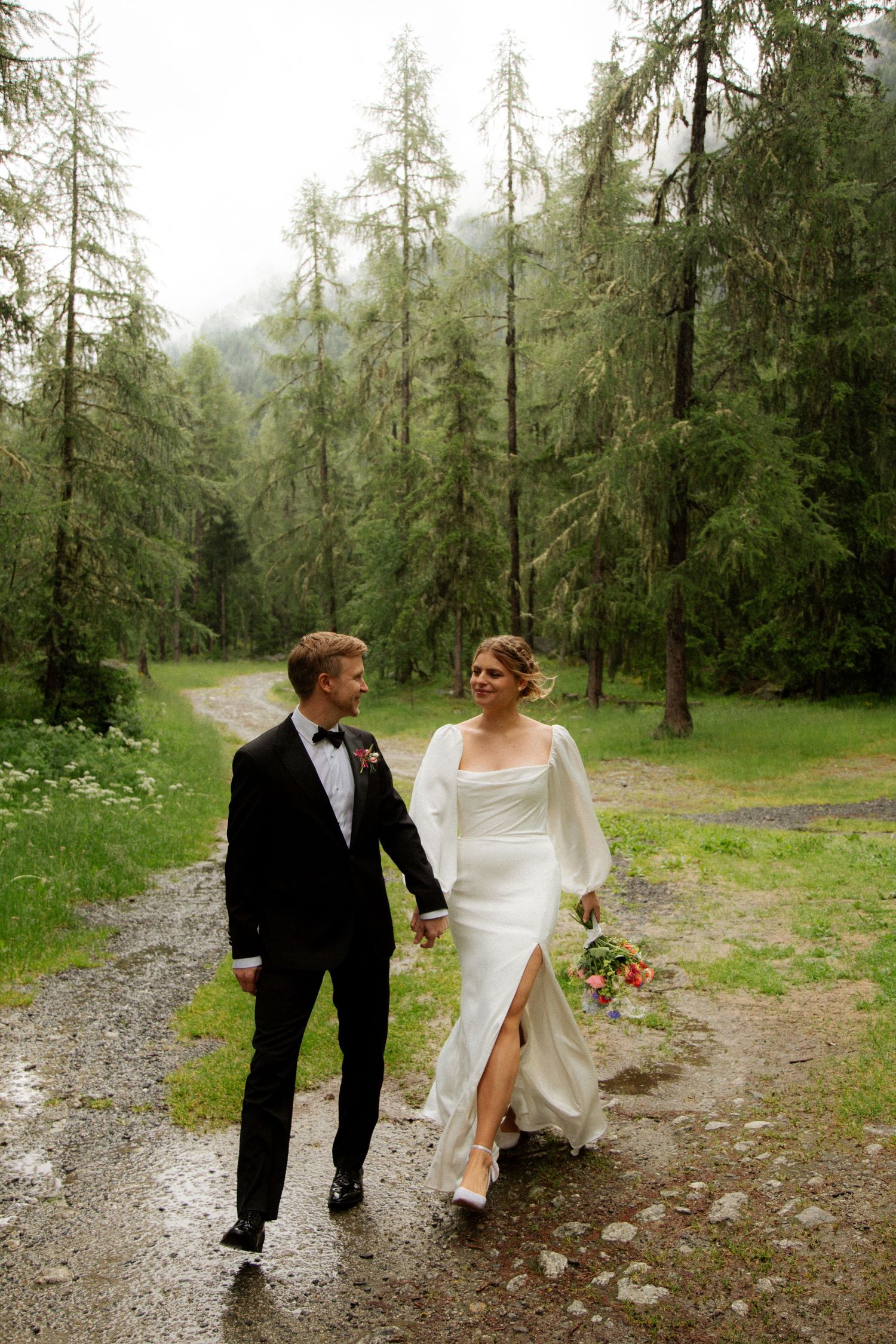 Morzine Wedding photographer captures rainy wedding photos at chamonix wedding venue. Candid timeless documentary style photos.