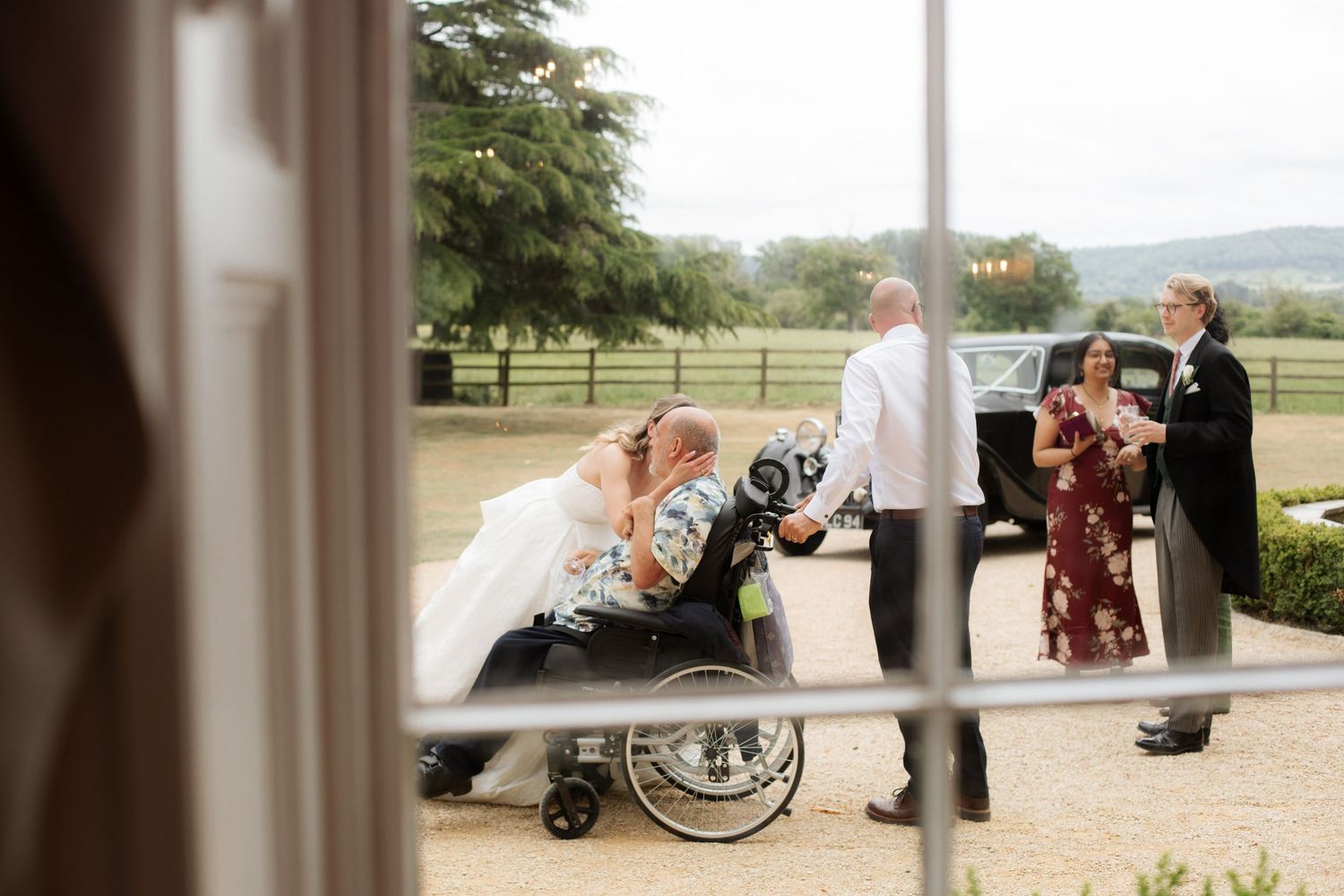 Documentary Style Cotswold Wedding Photographer captures wedding party at a Gloucestershire Wedding Venue. natural and candid wedding photos