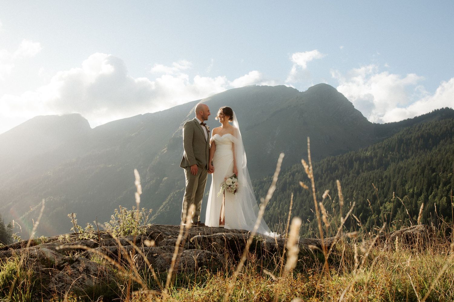 Morzine Wedding photographer captures stunning sunset wedding photos with a mountain backdrop.Candid timeless documentary style photosMorzin