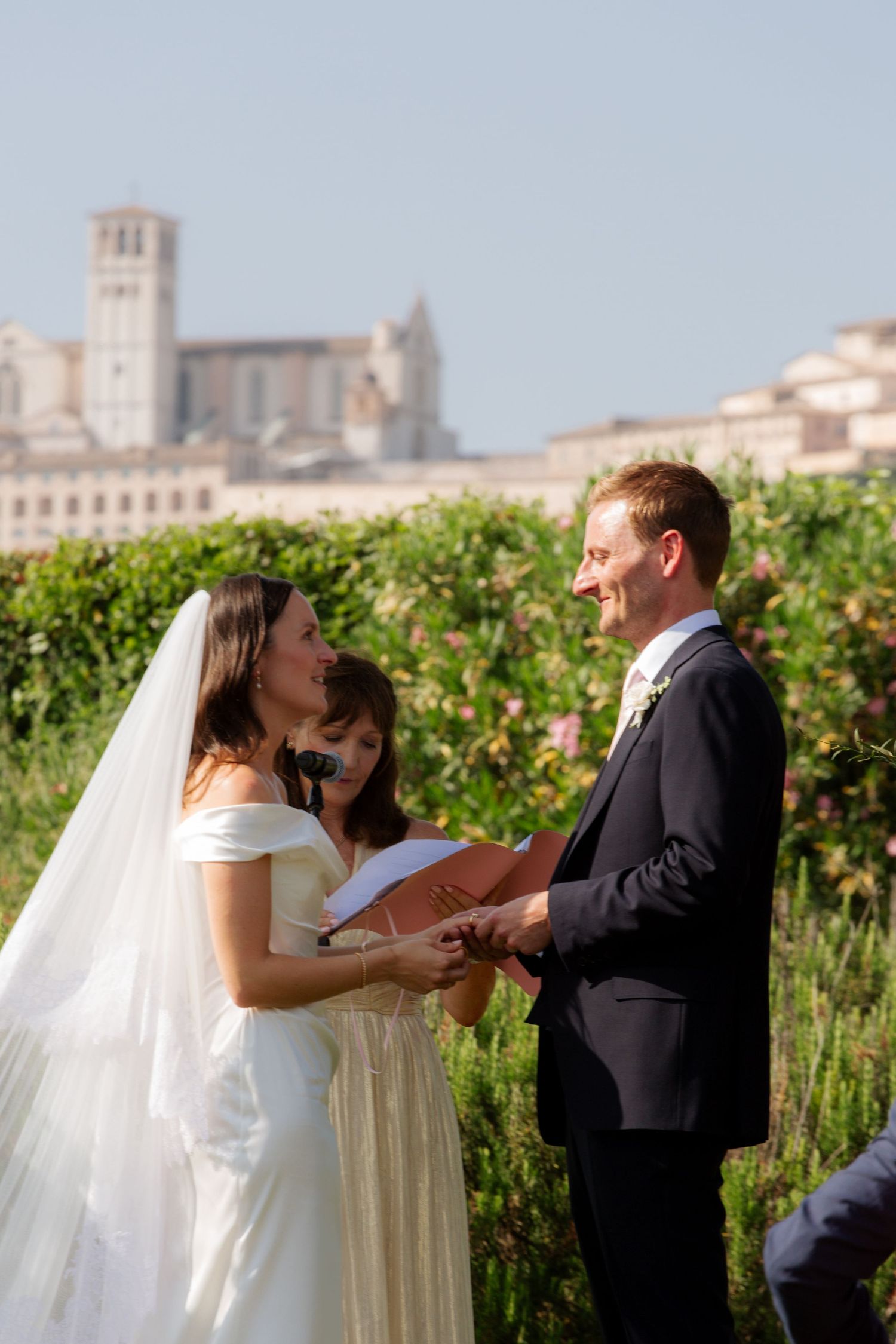 Assisi Wedding ceremony in Italy captured by destination wedding photographer, candid, natural style. Documentary style wedding photography.
