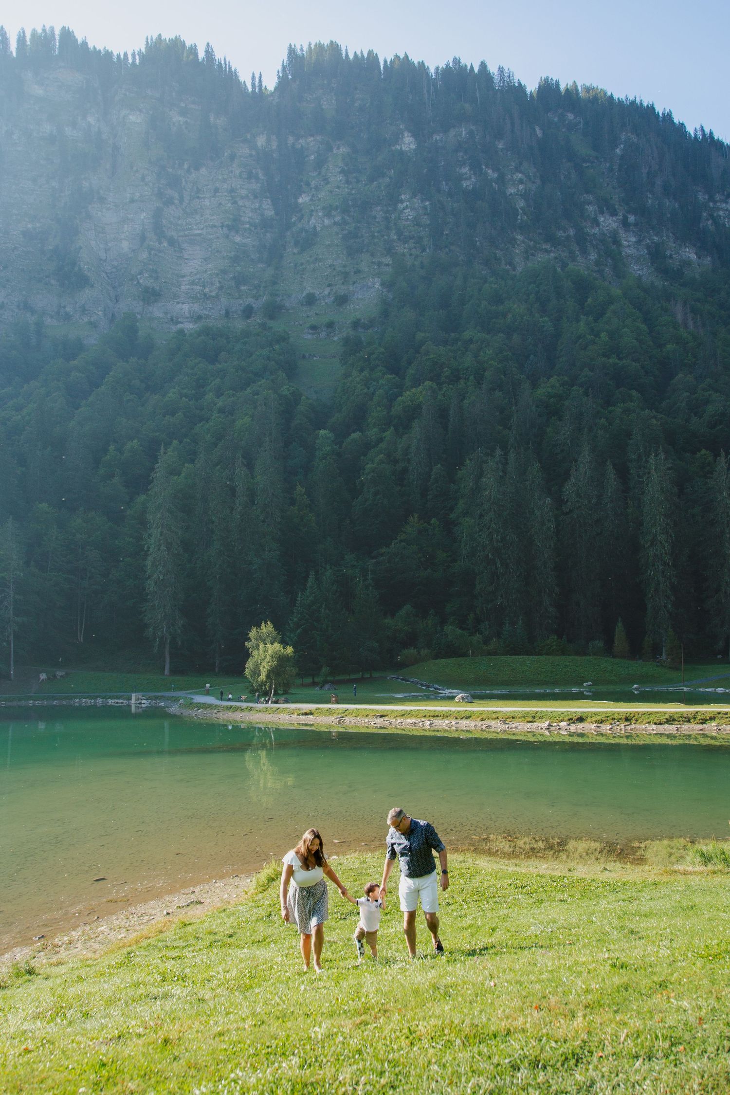 Outdoor family photography session next to Lake Montriond. Captured by Morzine Family photographer. Natural family portraits in morzine