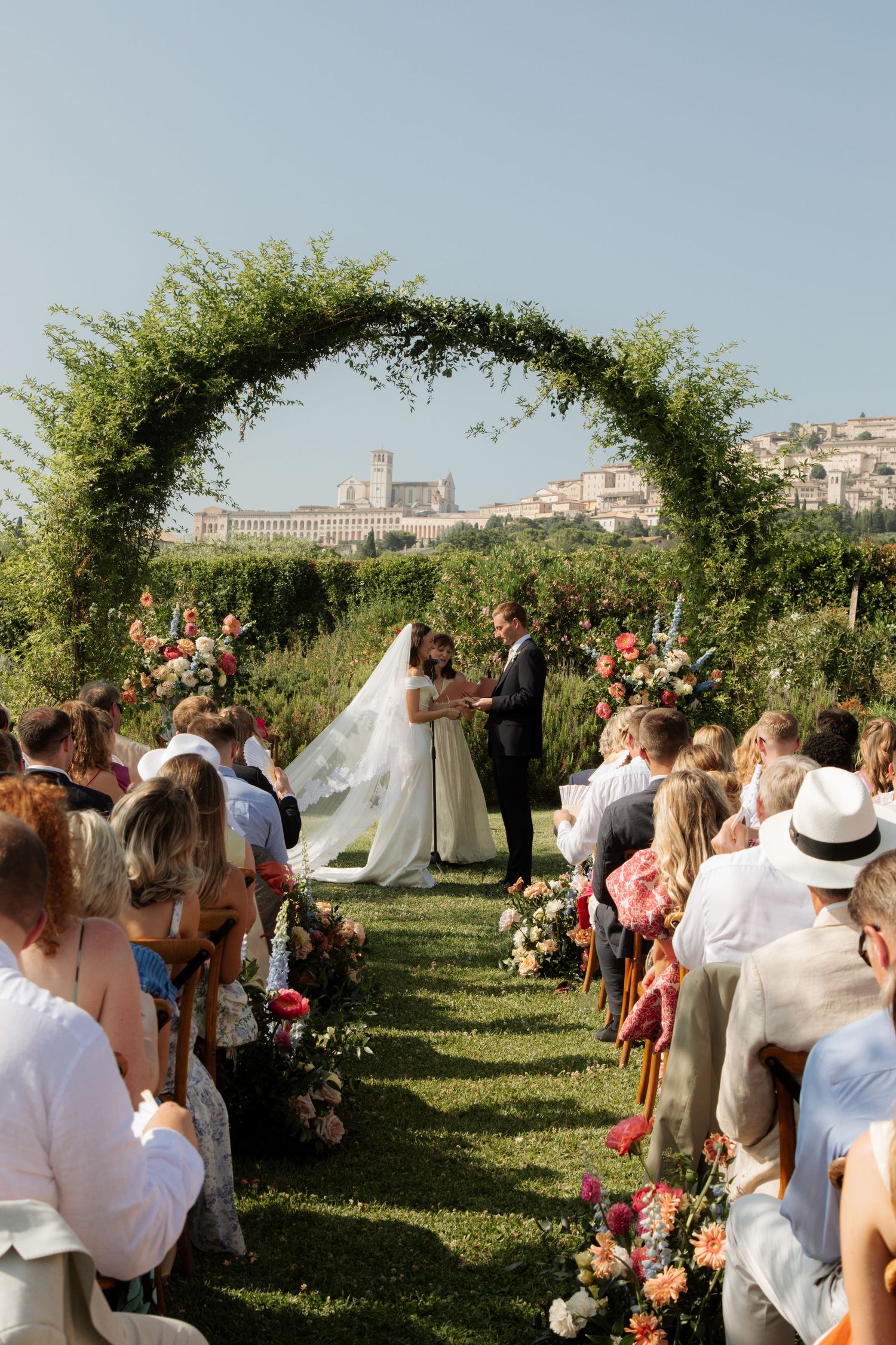 Italian Wedding photos in Assisi captured by destination wedding photographer, candid, natural style. Documentary style wedding photography.
