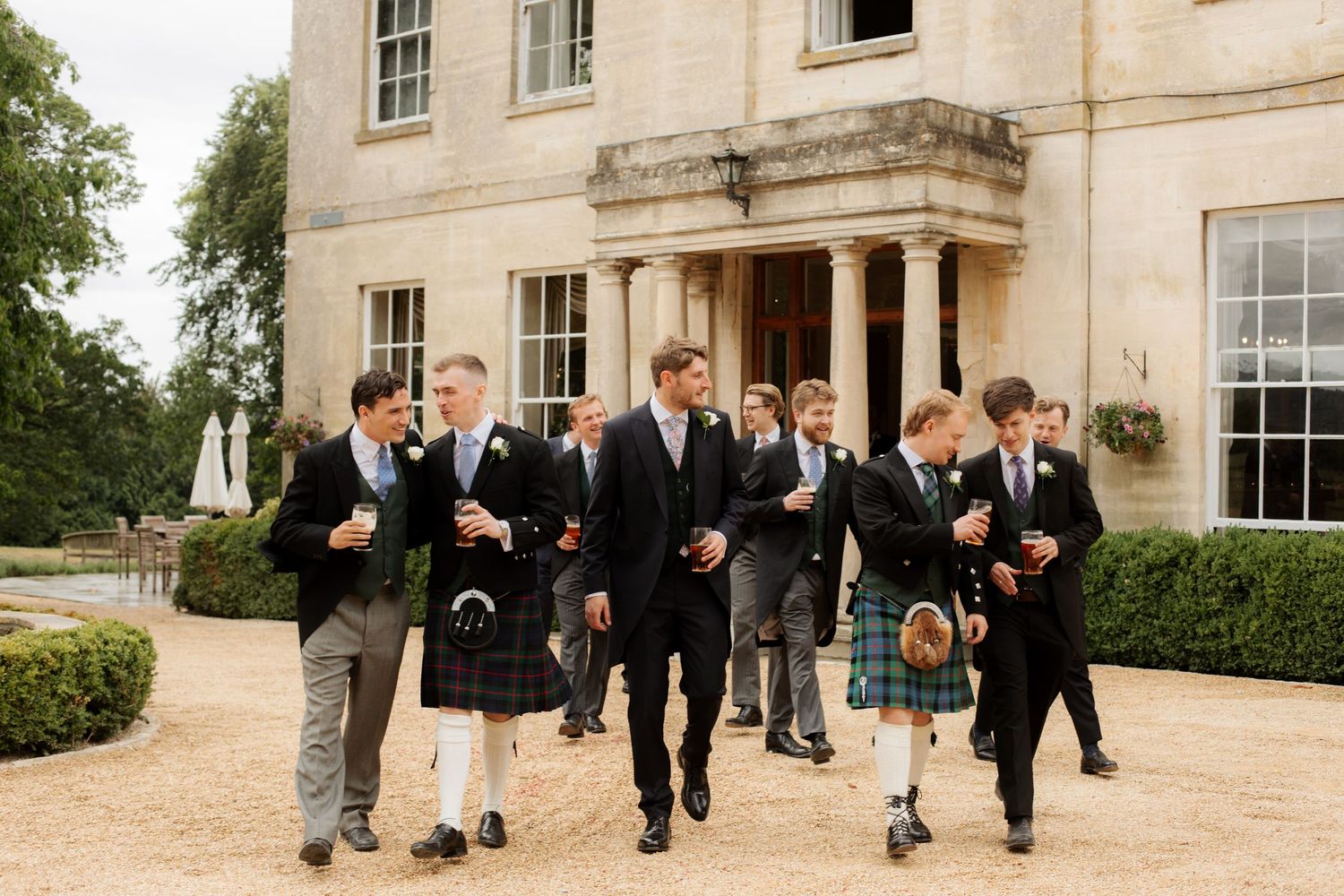 Documentary Style Cotswold Wedding Photographer captures groomsmen at Gloucestershire Wedding Venue.Natural,candid and timeless photography