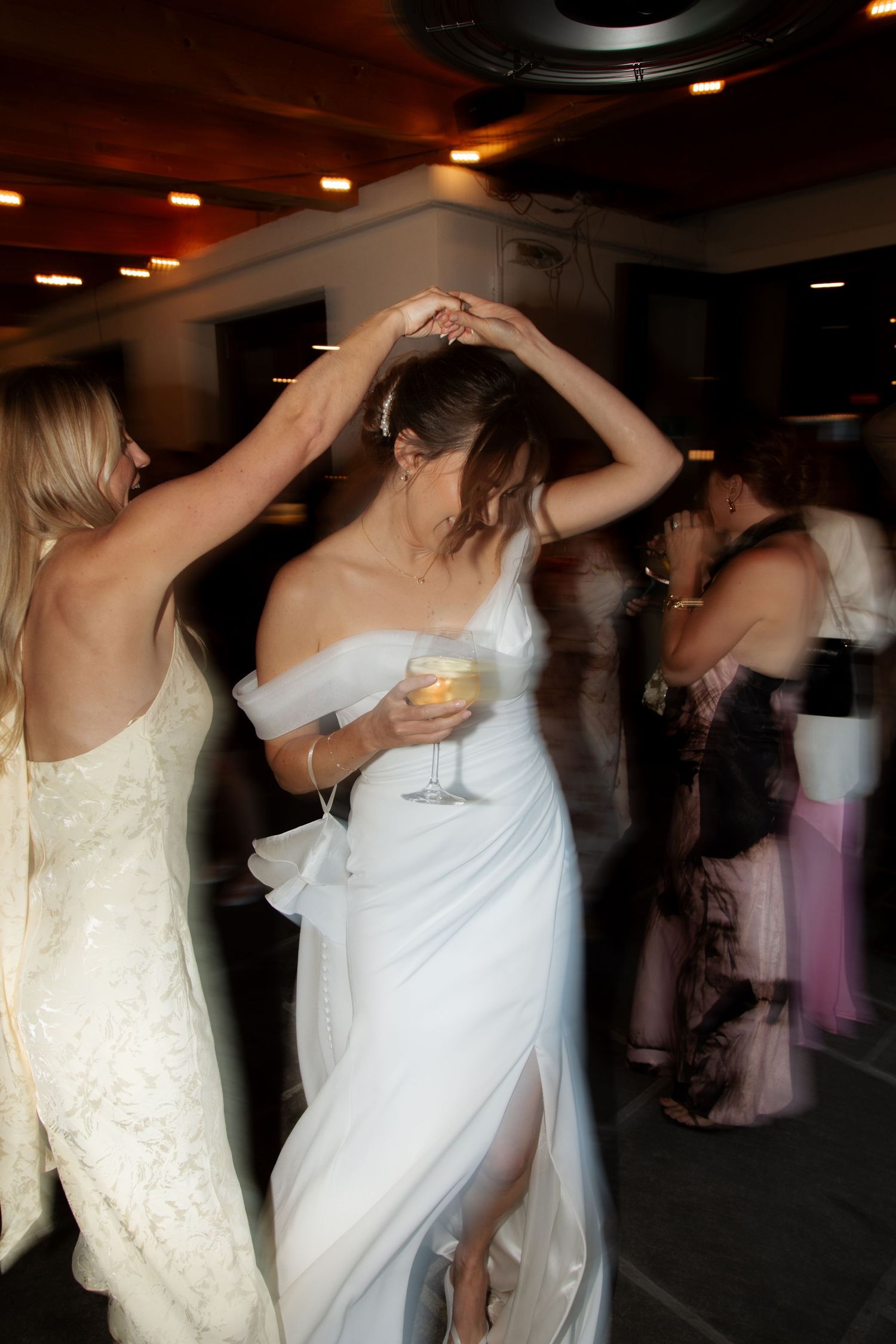 Morzine Wedding photographer captures wedding party dancing at montriond wedding venue. Candid timeless documentary style photos.Flash photo