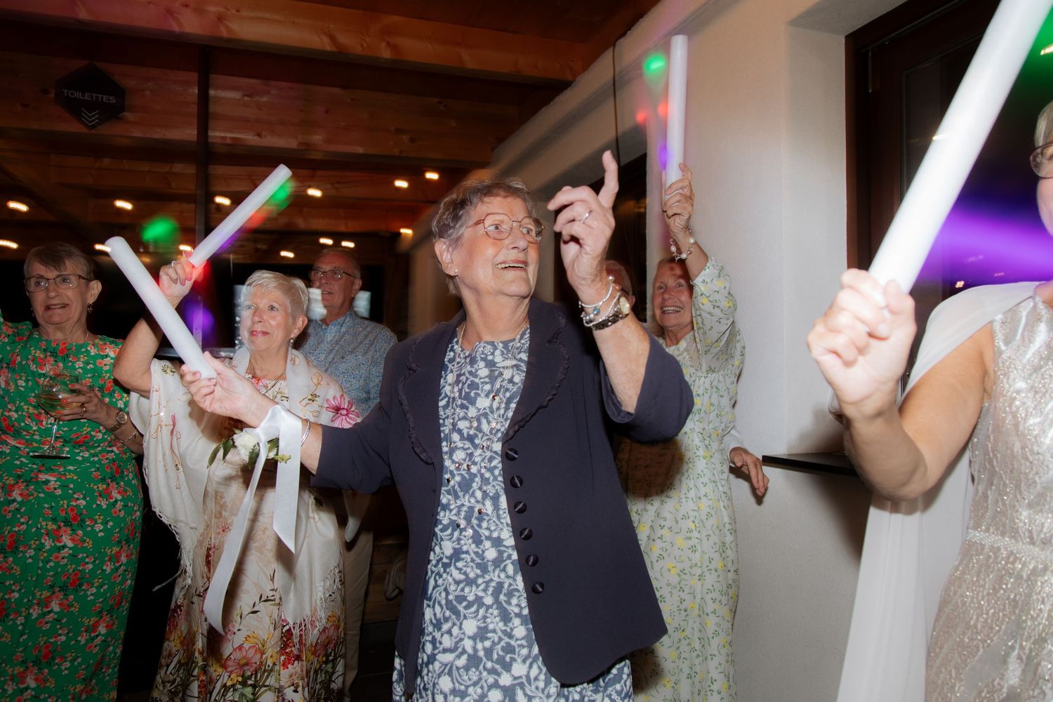 Morzine Wedding photographer captures flash photos of wedding party at Montriond Wedding Venue, Lake Montriond.Candid timeless documentary