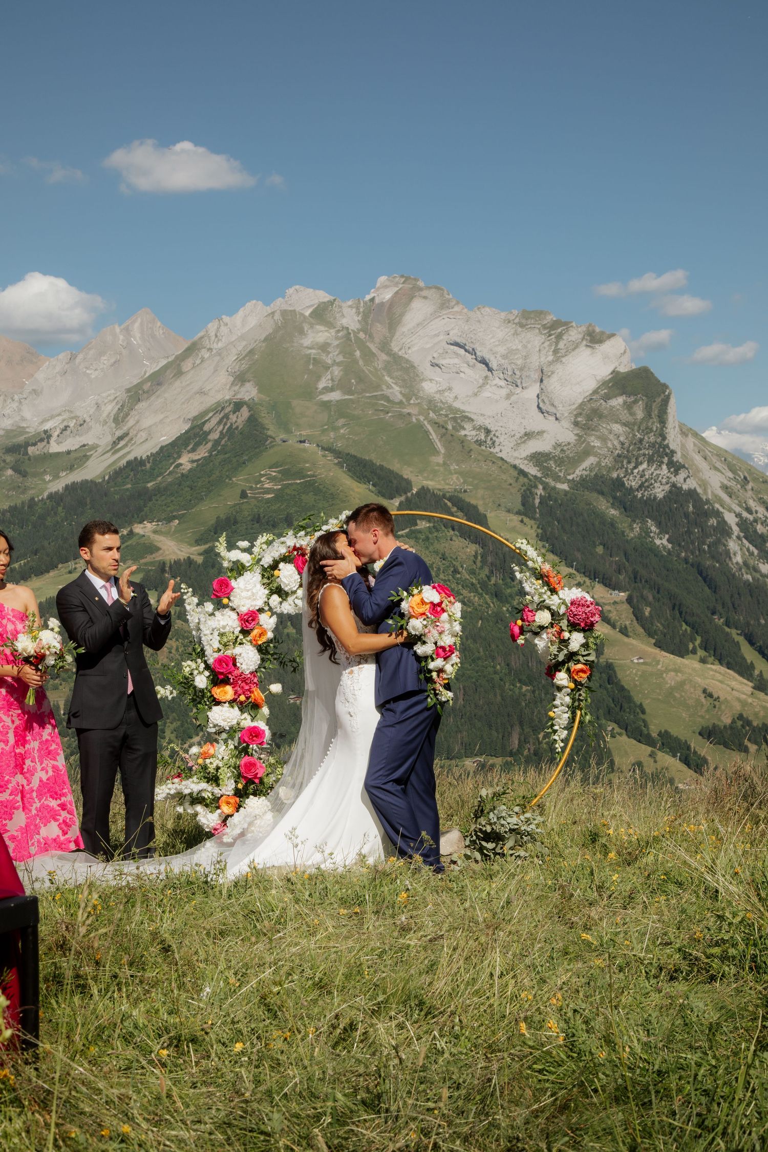 Morzine Wedding Photographer captures fun confetti photo at La Clusaz Wedding venue. French Mountain Wedding photographer. Outdoor Bride