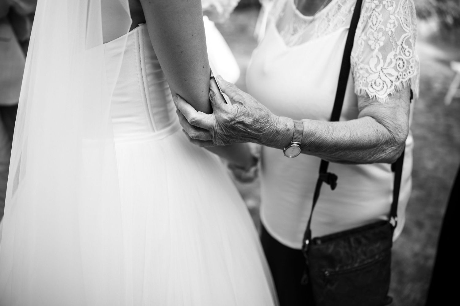 Elegant white wedding dress details with lace and tulle.