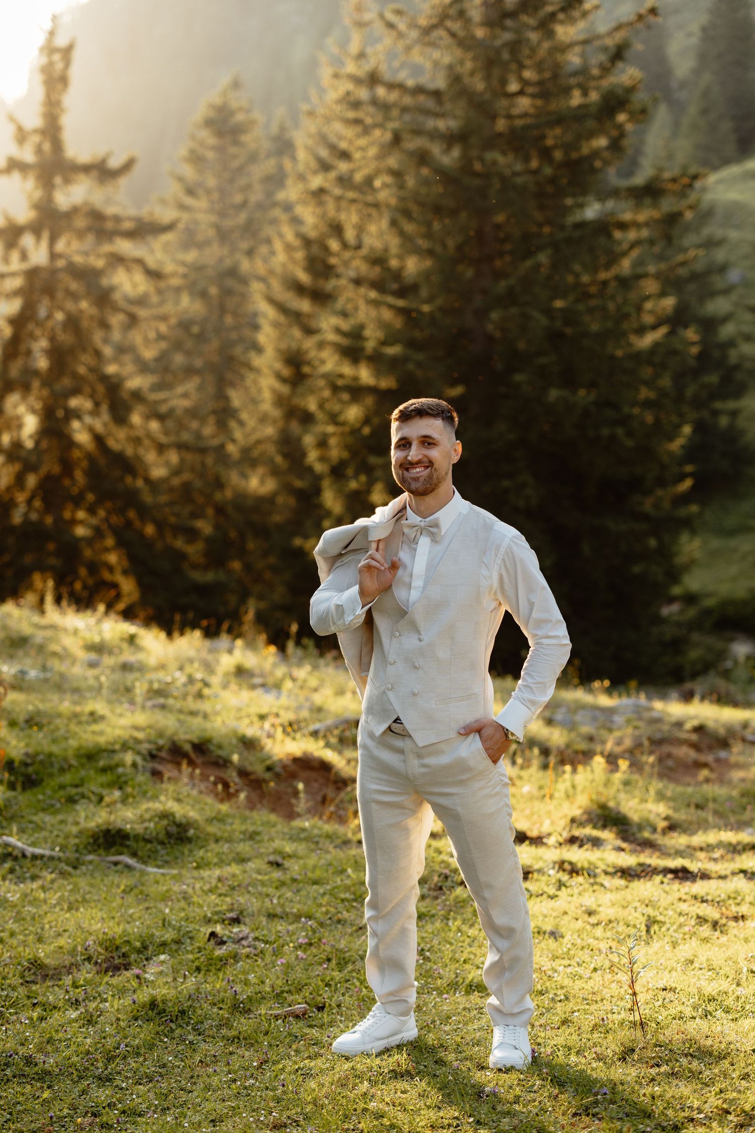 A playful series of photos showing someone in all-white attire posing on a grassy hillside at sunset.