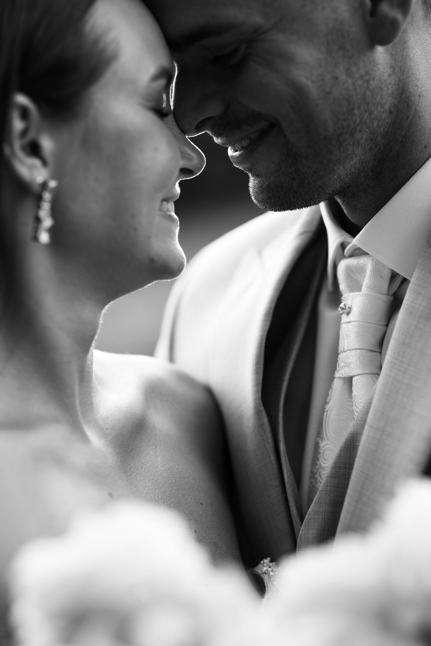Black and white series of romantic close-up wedding portraits showing tender moments.