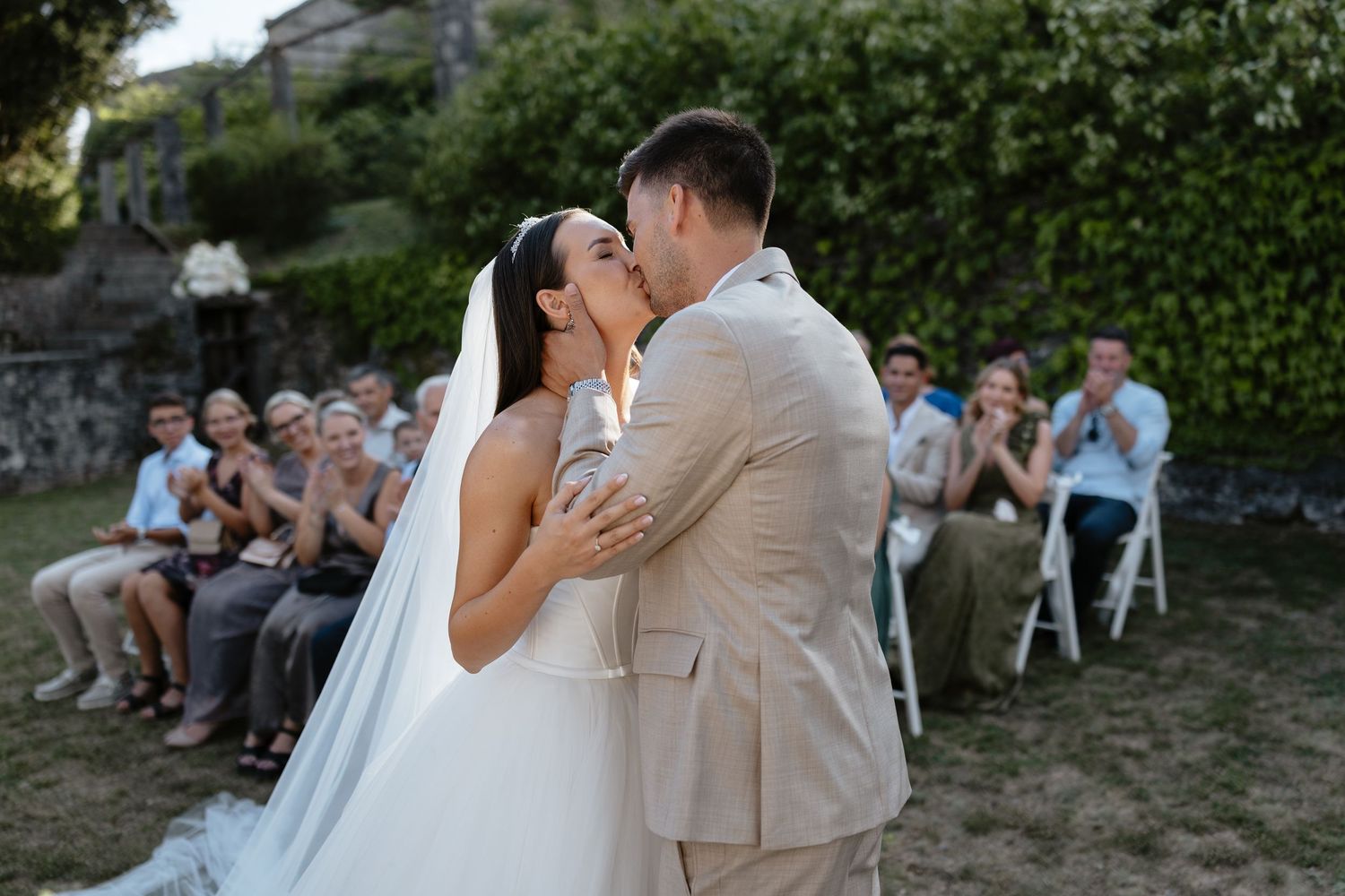 Wedding ceremony moments captured in an outdoor garden setting.