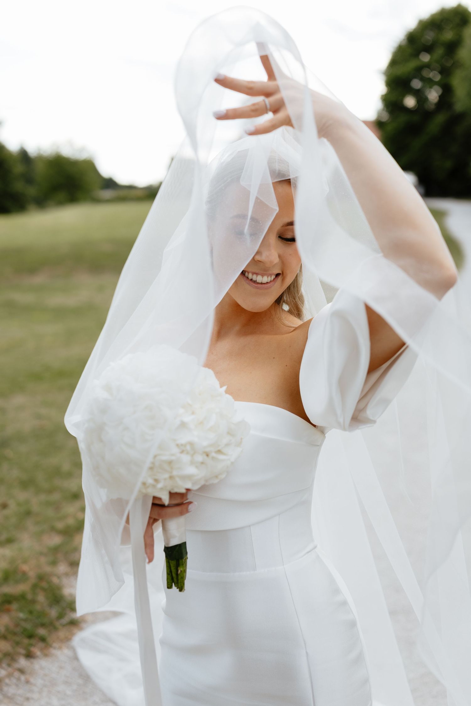 Ethereal bridal portraits showing flowing veil movement against natural lighting.