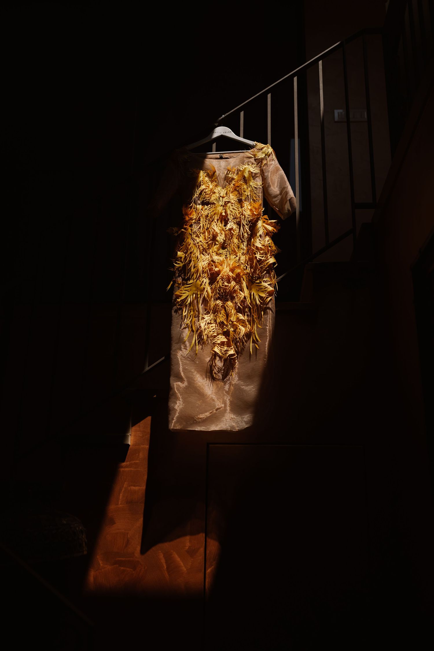 Paper bag lantern with golden lights creates a dramatic glow in dark setting.
