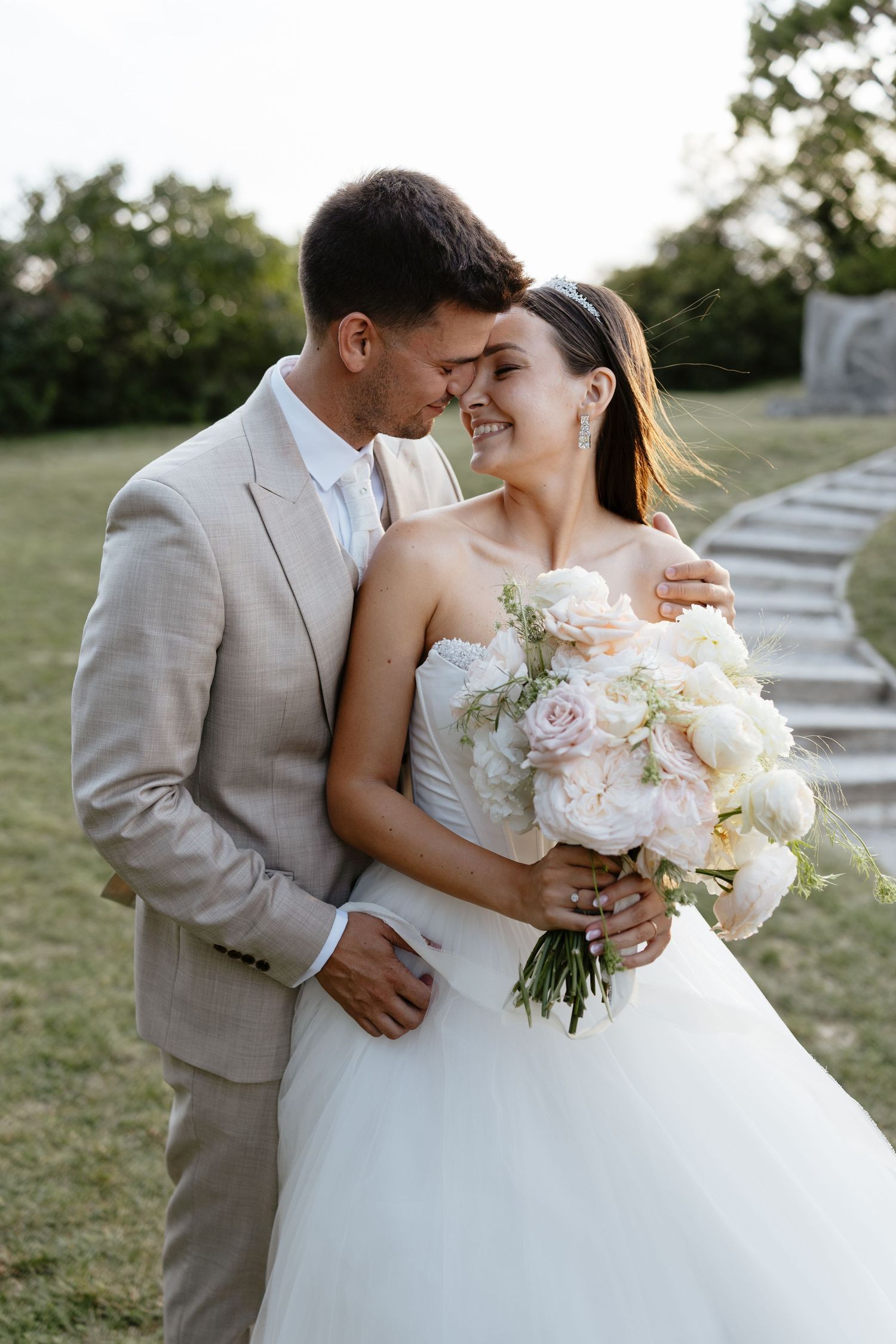 Romantic garden wedding portrait with soft natural lighting.