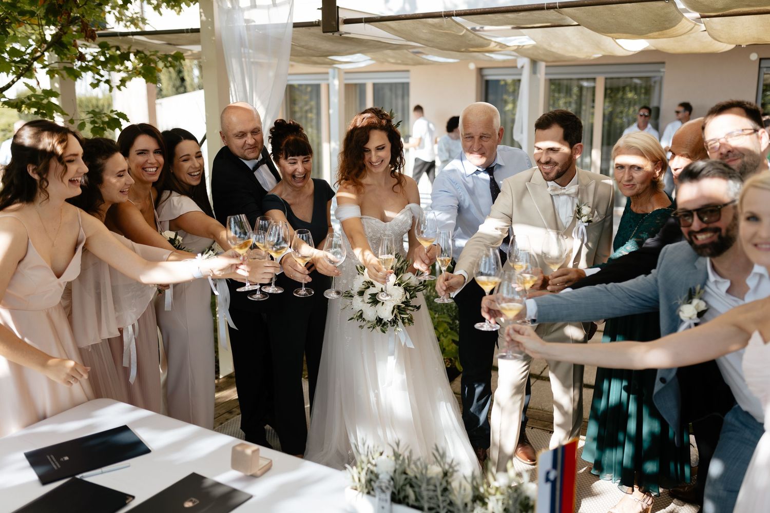 A collage of wedding celebration moments showing dancing, embracing, and joyful interactions at an elegant reception.