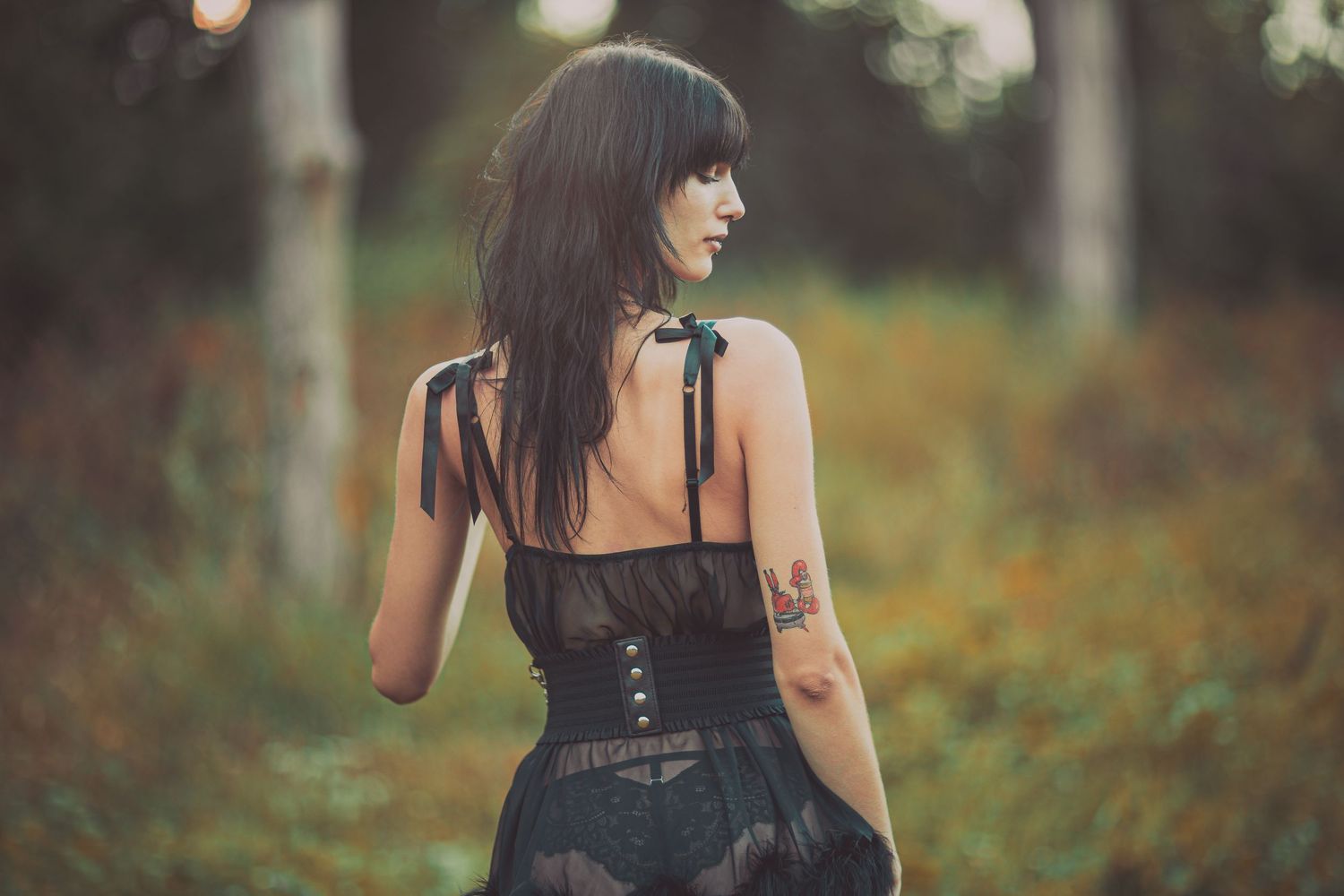Artistic outdoor portrait series showing details of black lace fashion styling.