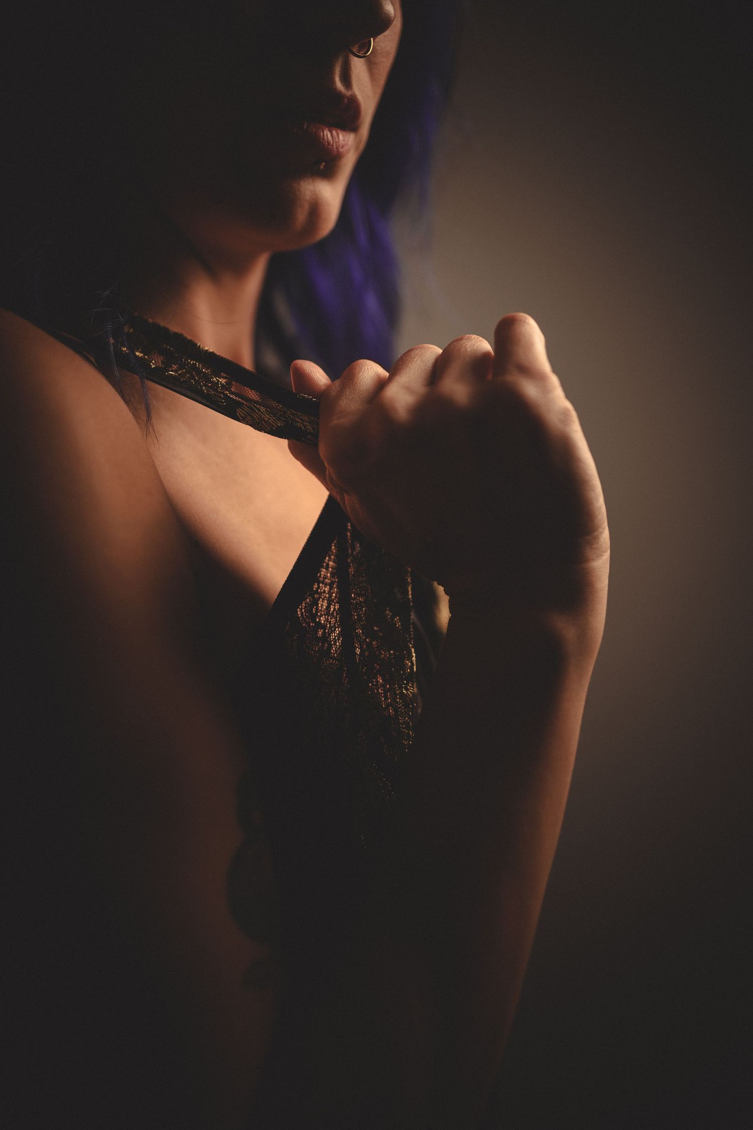 Artistic silhouette portrait in soft dramatic lighting.