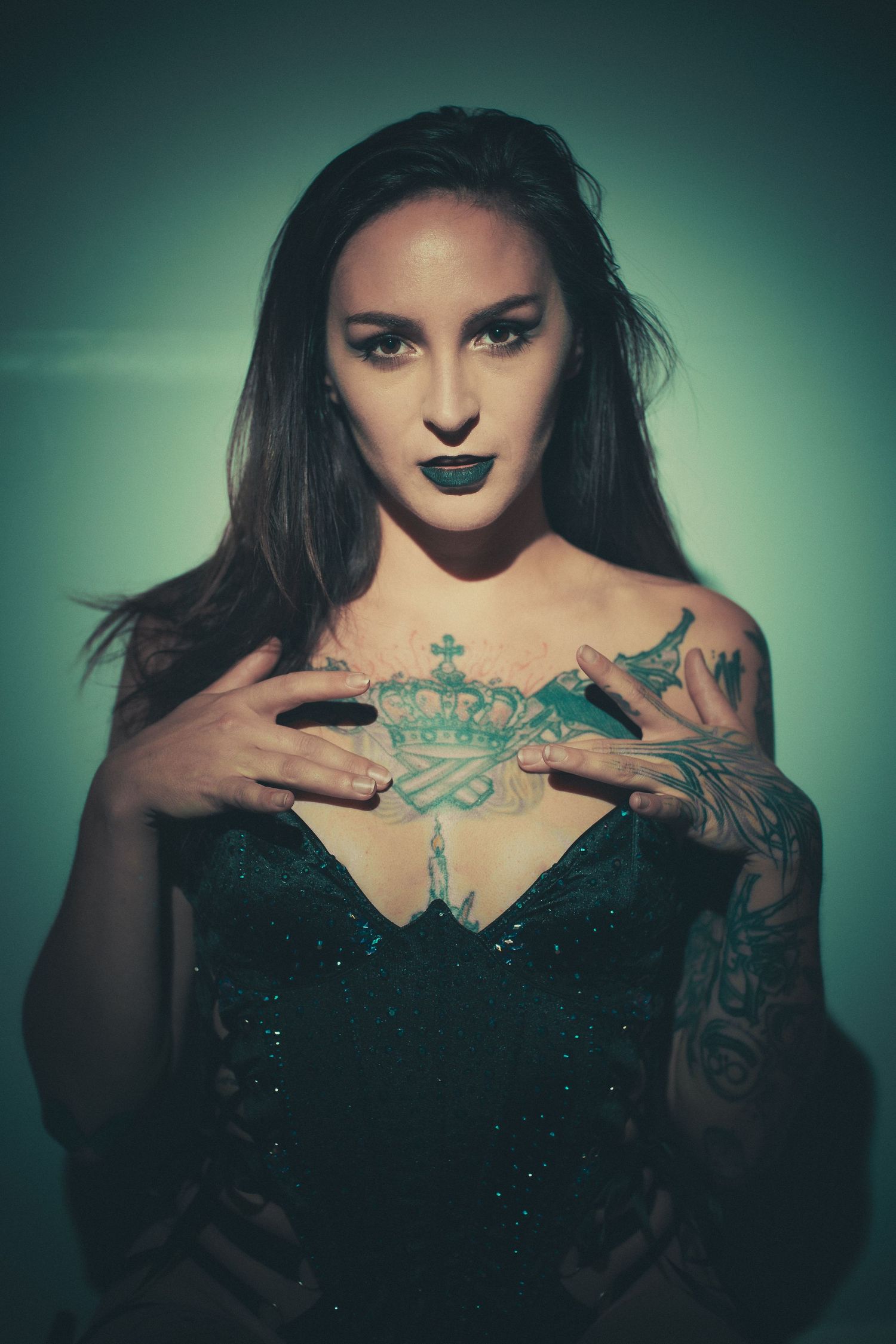 Gothic style portrait in dark glamour aesthetic with tattoos.