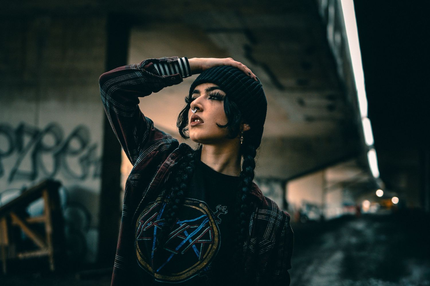 Urban night photography with dramatic lighting in industrial setting.