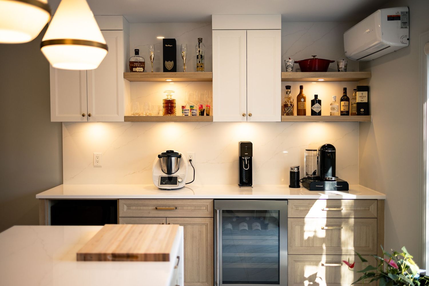 Modern kitchen with stainless steel appliances and white walls shown in panoramic sequence.